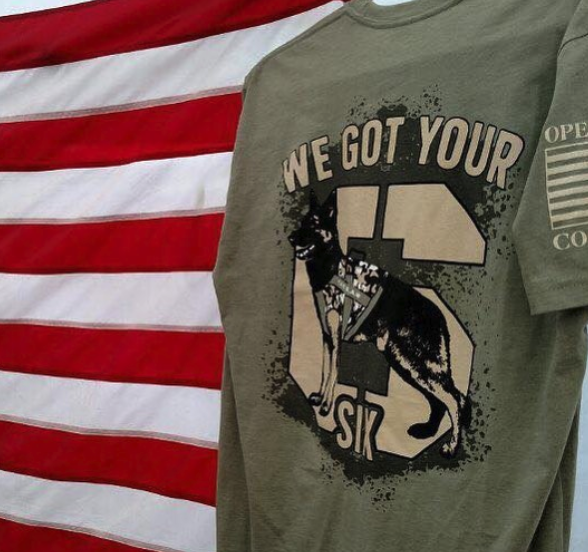 T-shirt with a graphic of a K-9 police dog and the words "We Got Your Six" in front of an American flag background.