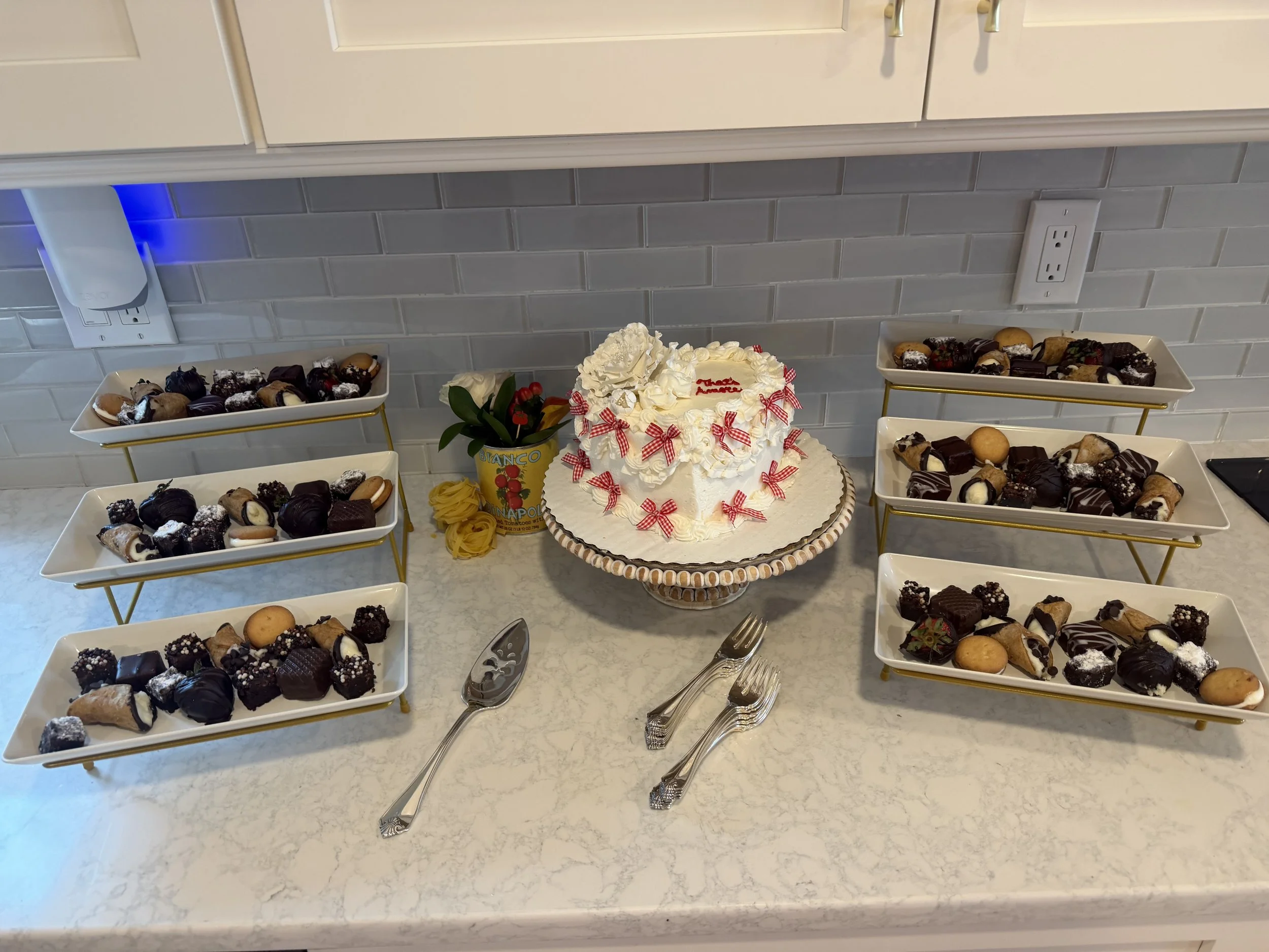Celebration dessert table featuring a decorated cake and assorted treats.