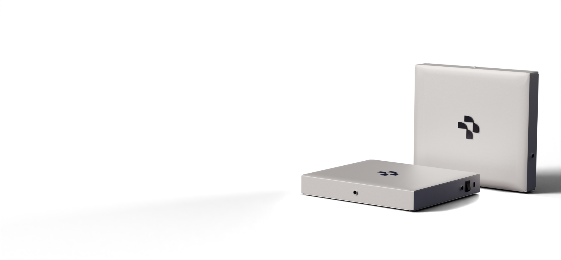 Two white electronic devices with black logos, one standing upright and the other lying flat, against a black background.