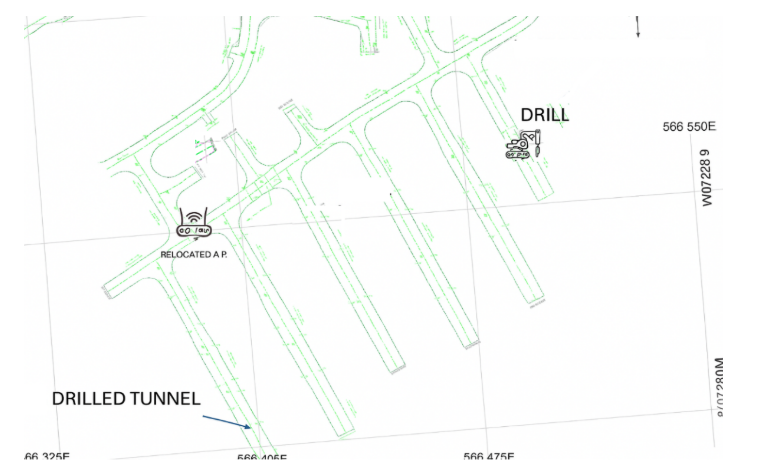 Map showing underground construction with drilled tunnel, drill, and relocated access point.