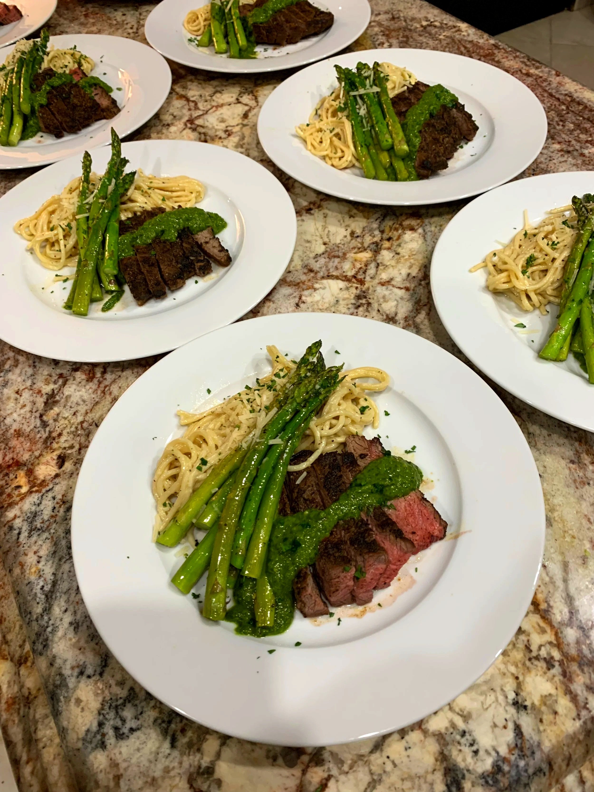 Plated dinner with flank steak, asparagus and pasta with a chimichurri sauce for a plated dinner service in Scottsdale, AZ