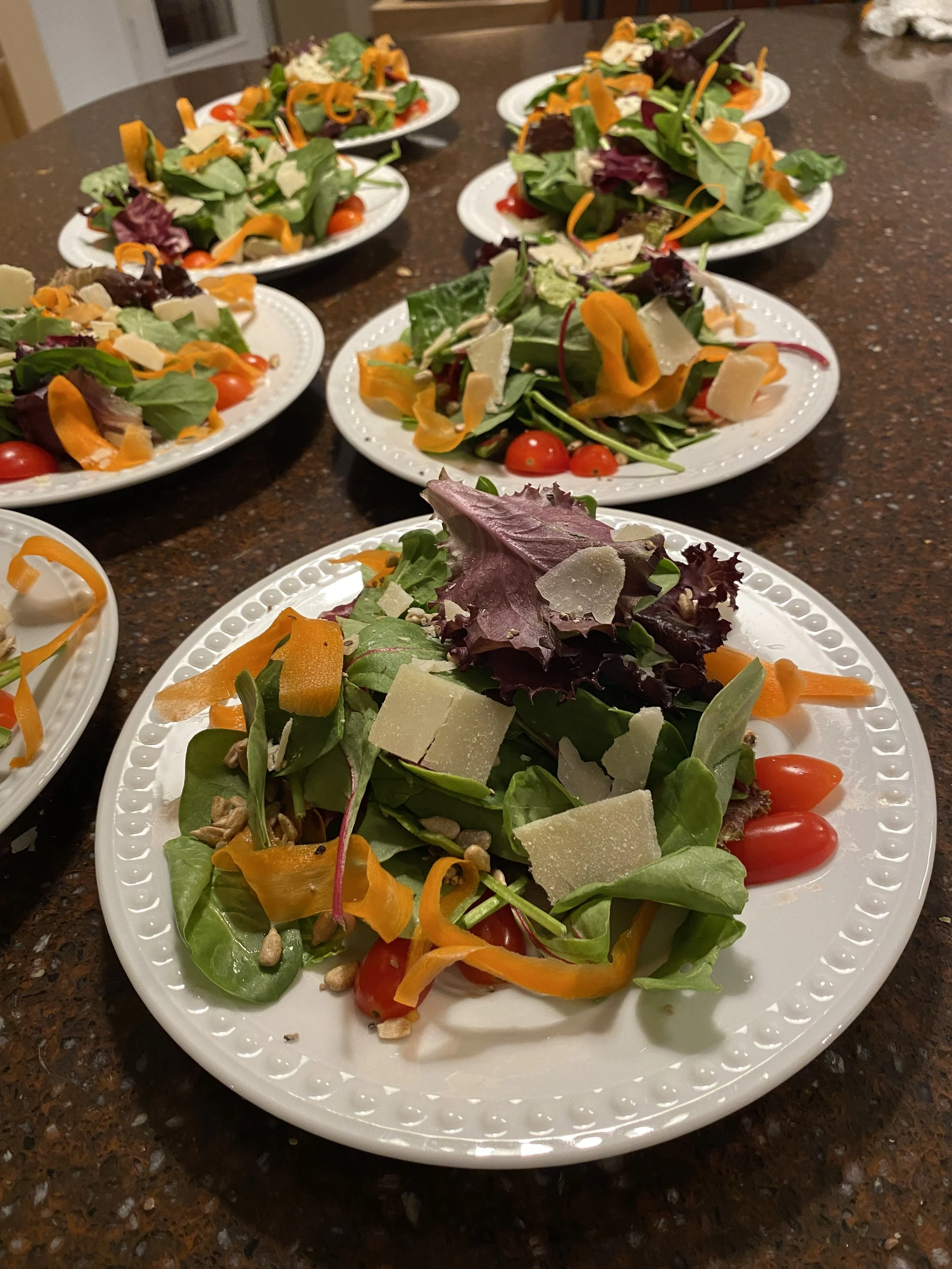 Rows of freshly prepared artisan salads ready for service by a high-end personal chef at a Scottsdale event