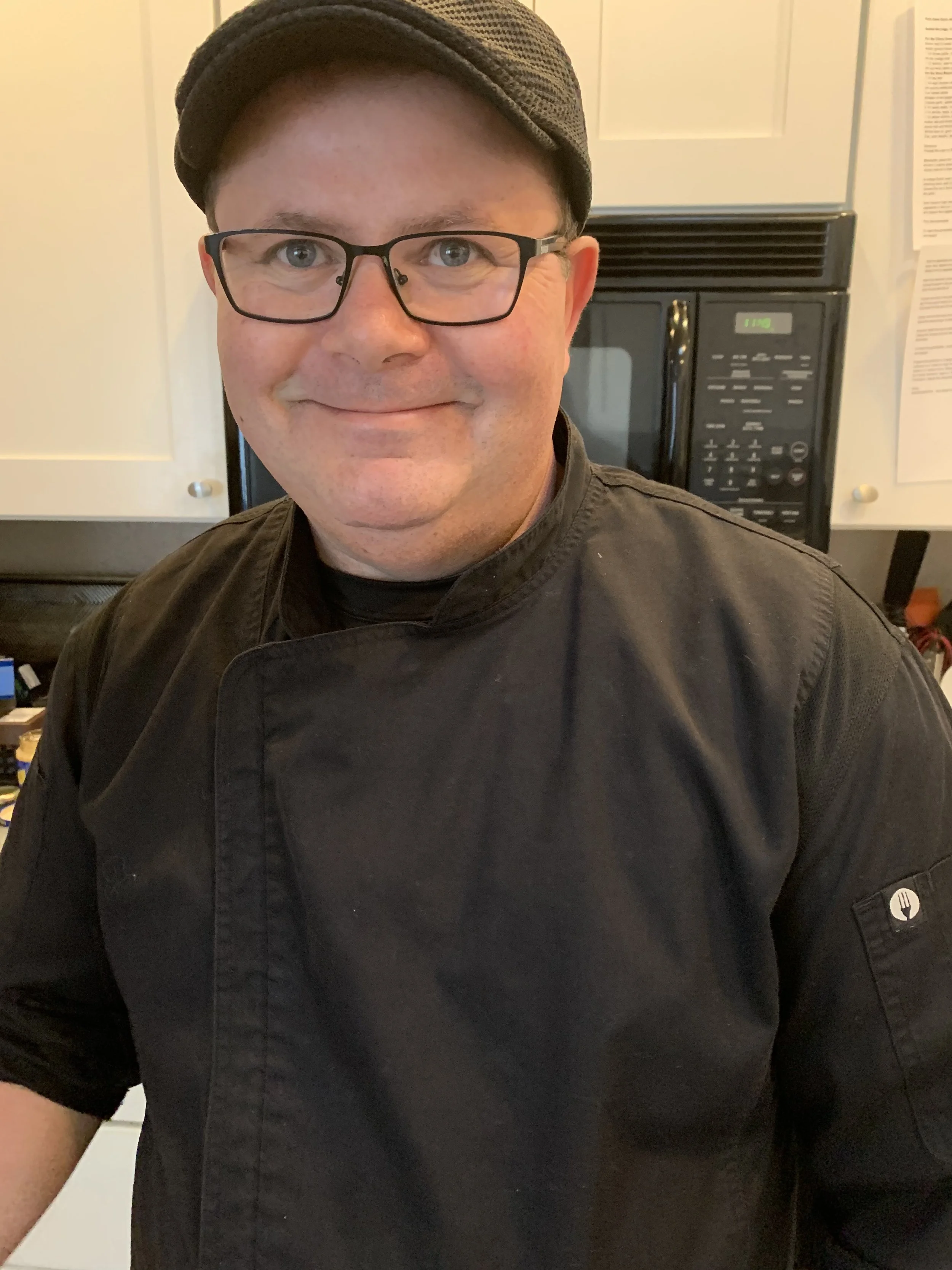 Chef Dean from Chef Dean Cultural Cuisine in a Phoenix Kitchen answering culinary questions.