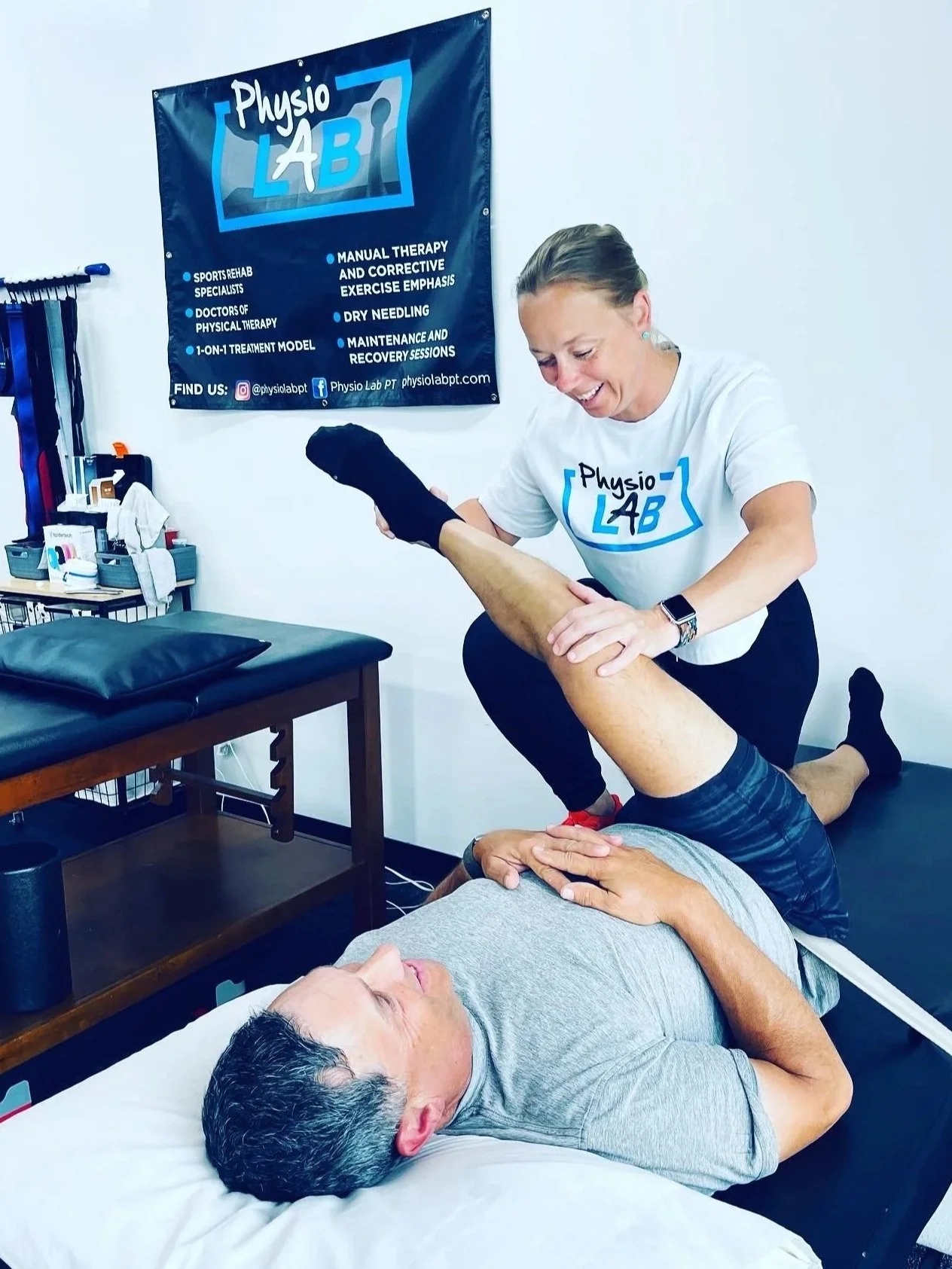 A stretch therapist helping a patient stretch his hamstring