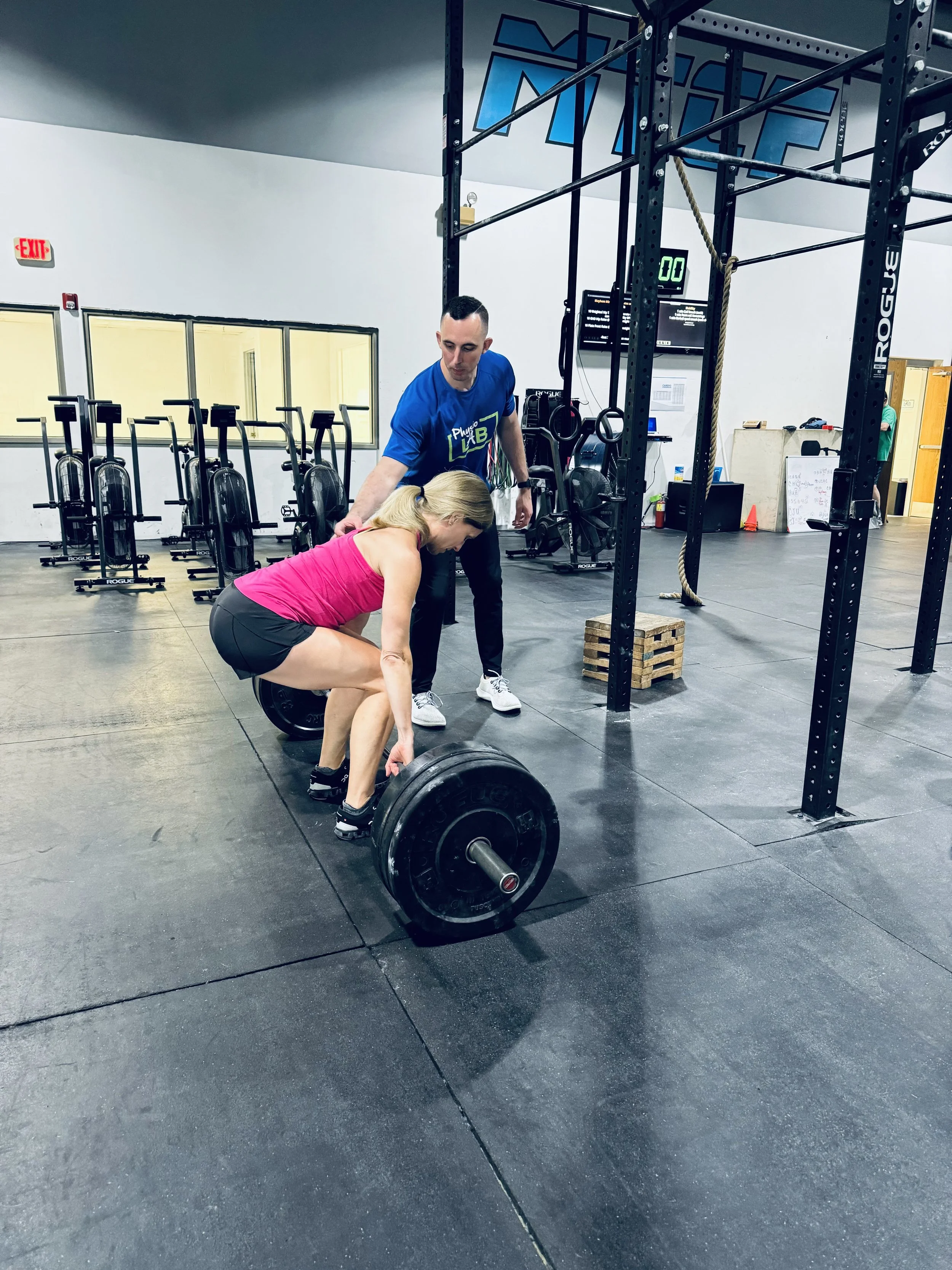 Abram Arwood, PT, DPT, coaching a deadlift