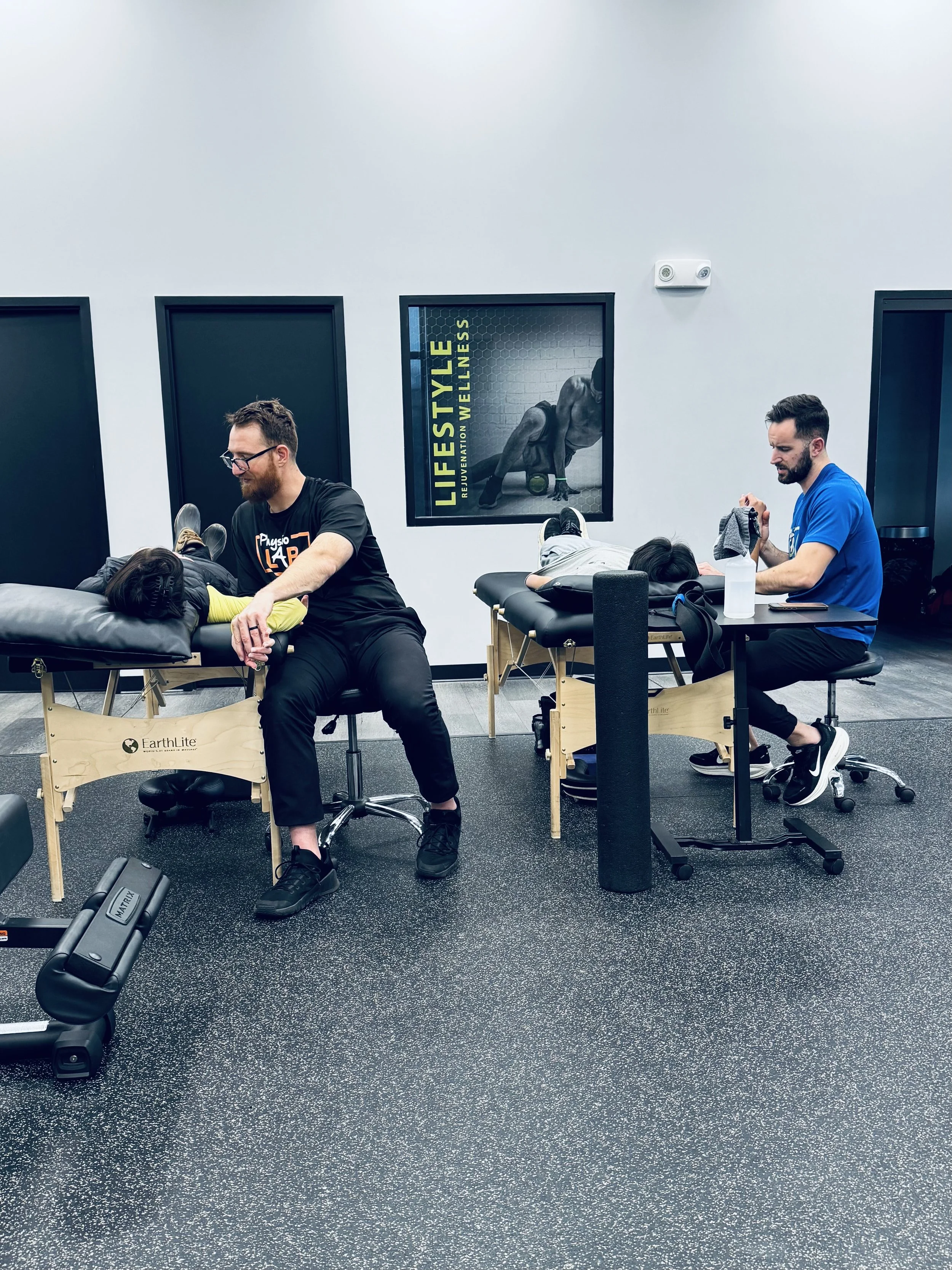 Brett Cash and Josh Reppert, PTS, DPTS, caring for patients