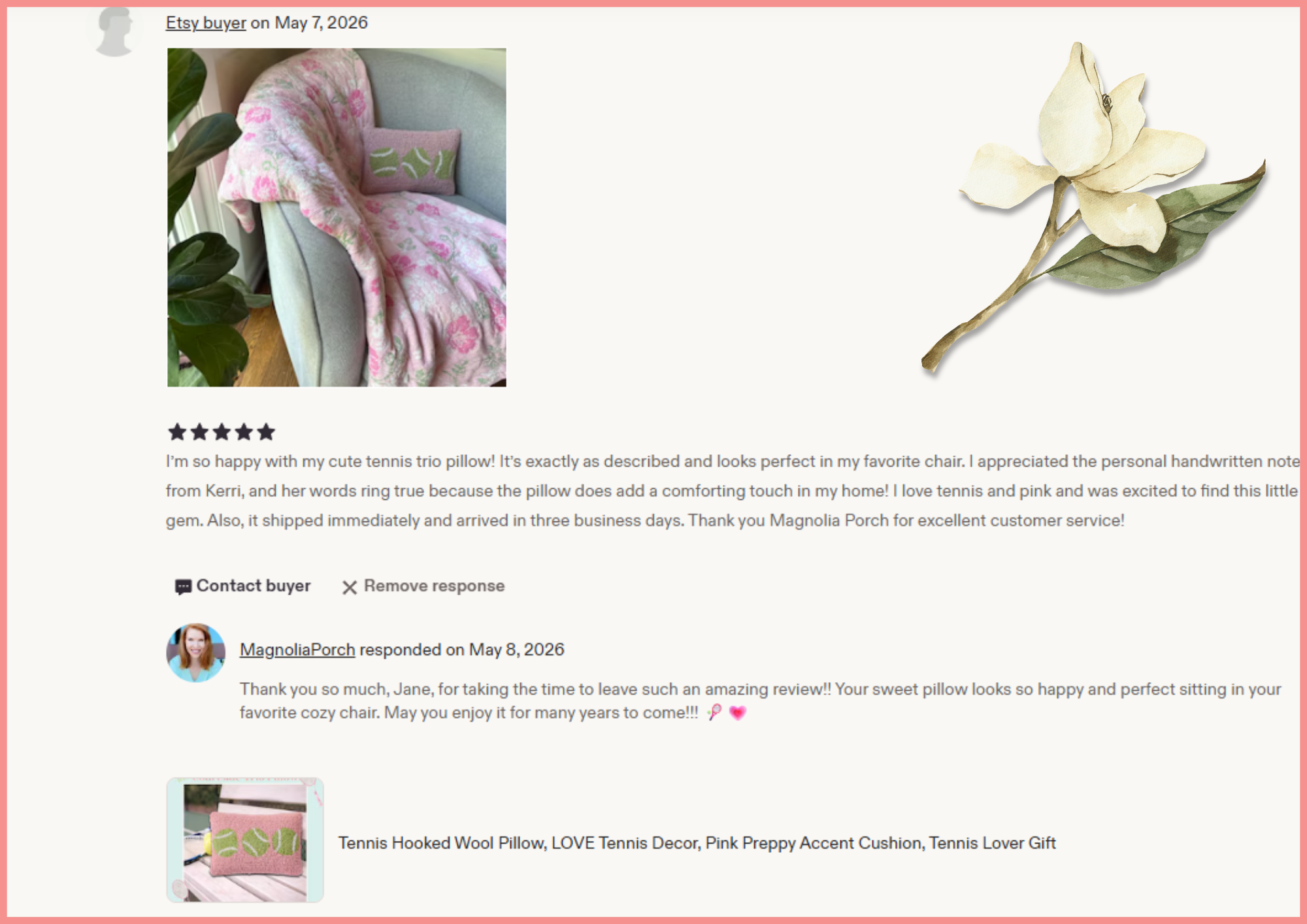 Photo of a pink wool pillow decorated with green tennis ball motifs, draped over a sofa armrest with a small pink pillow with green leaves, and a large indoor green plant nearby.