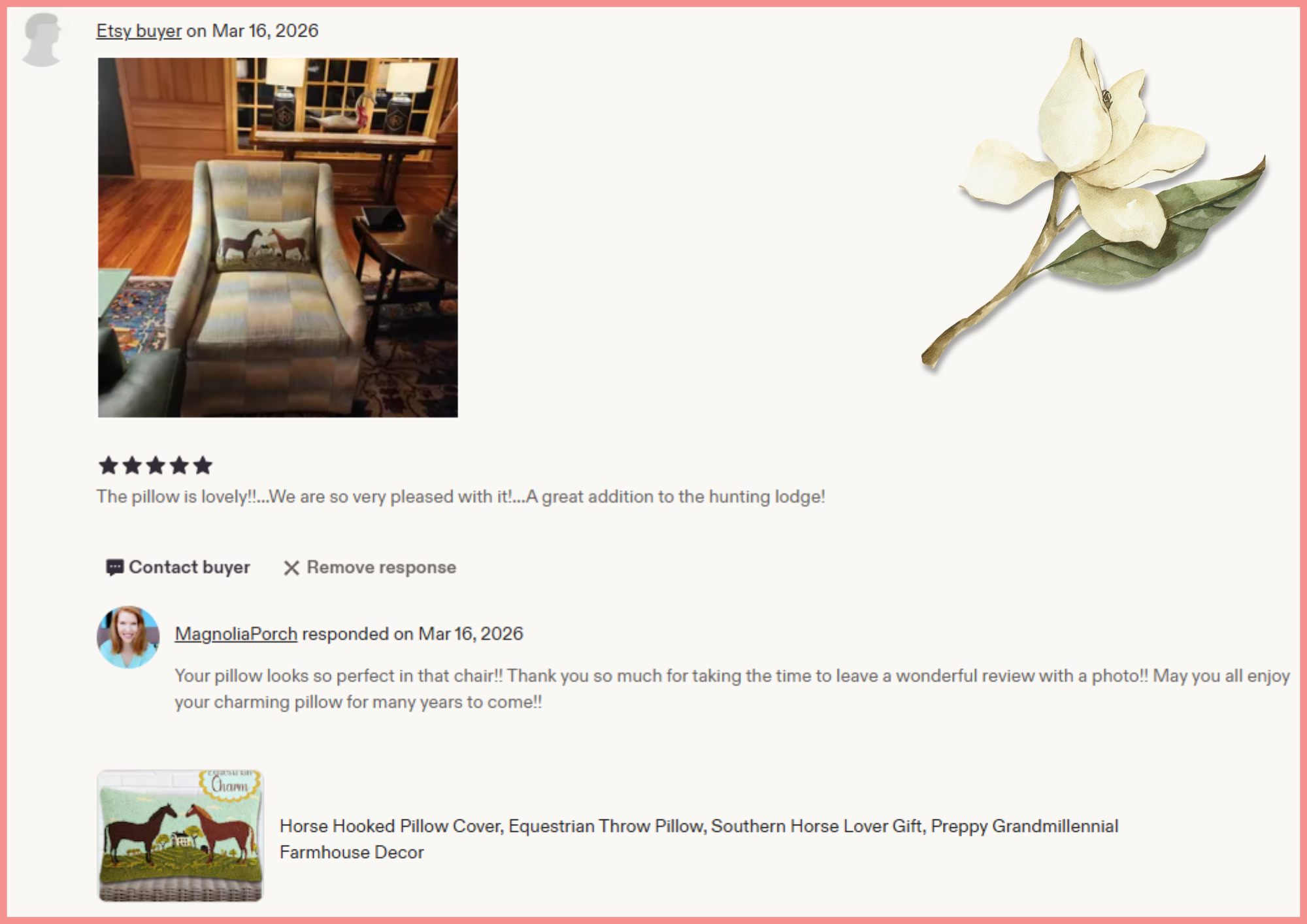 A screenshot from an online review page showing a pillow with a horse design in a rustic-style room with wooden floors, a patterned area rug, a wooden table, a window with divided panes, and lamps. The pillow has a design featuring two horses facing each other in front of a small house with a barn in the background.
