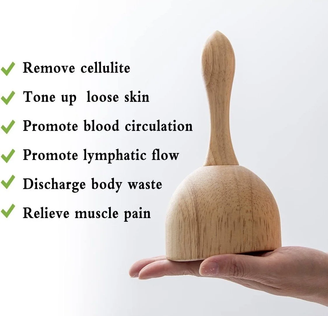 A wooden gua sha tool held in a person's hand with text listing its benefits: remove cellulite, tone up loose skin, promote blood circulation, promote lymphatic flow, discharge body waste, and relieve muscle pain.