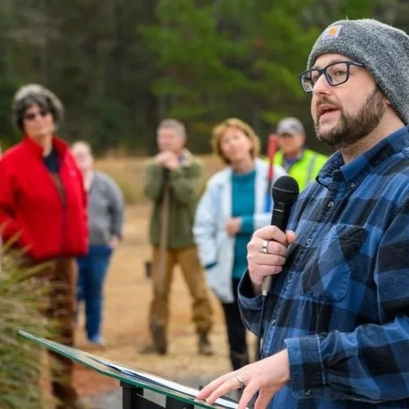 Commissioner David O’Keefe speaks at a Leon County tree-planting event at a Leon County greenway on Buck Lake Road.