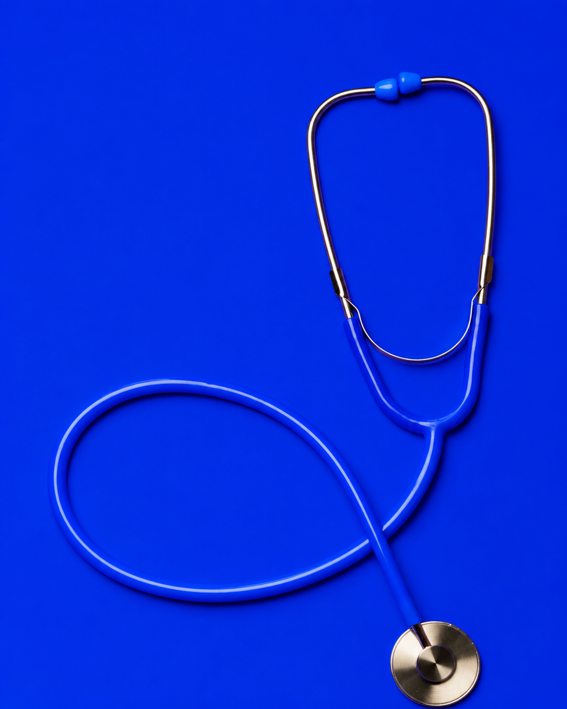Blue stethoscope on a blue background.