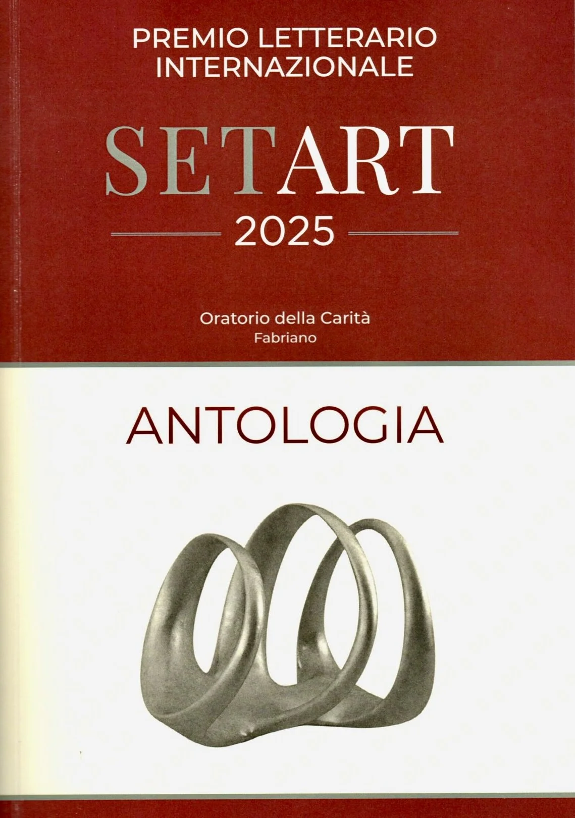 Copertina di un libro intitolato 'SetArt 2025. Antologia' con un’immagine di due anelli d’argento sovrapposti.