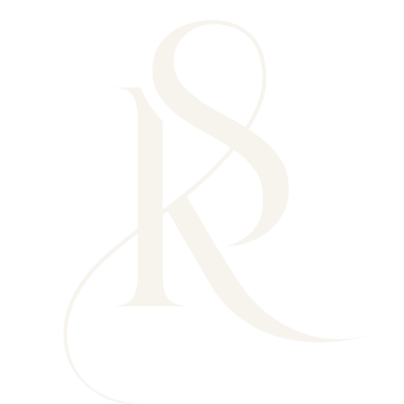 A stylized white monogram of the letters 'S' and 'R' on a black background.