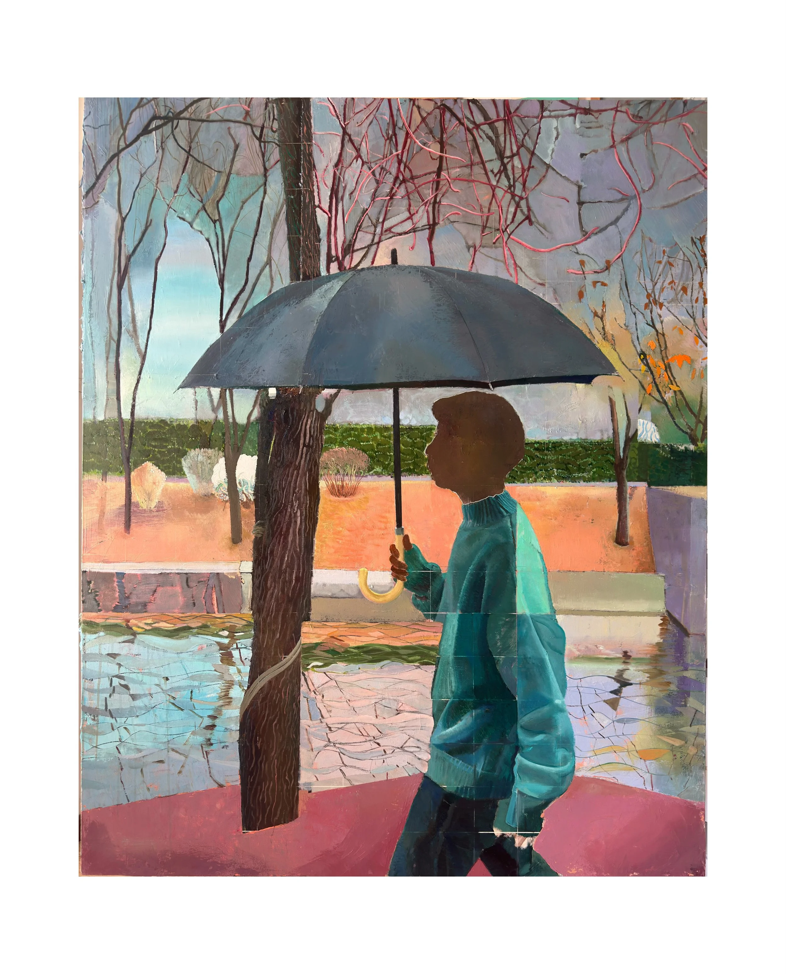 A boy with curly hair and a turquoise jacket holding a yellow umbrella on a rainy day, standing near a tree and in reflection in a puddle.