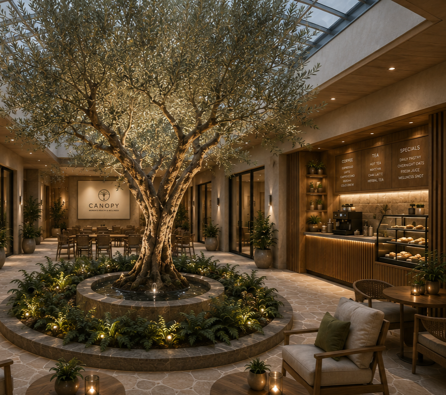 Modern café and community gathering space featuring a central olive tree, tranquil water feature, comfortable seating, and specialty coffee in a welcoming wellness environment.