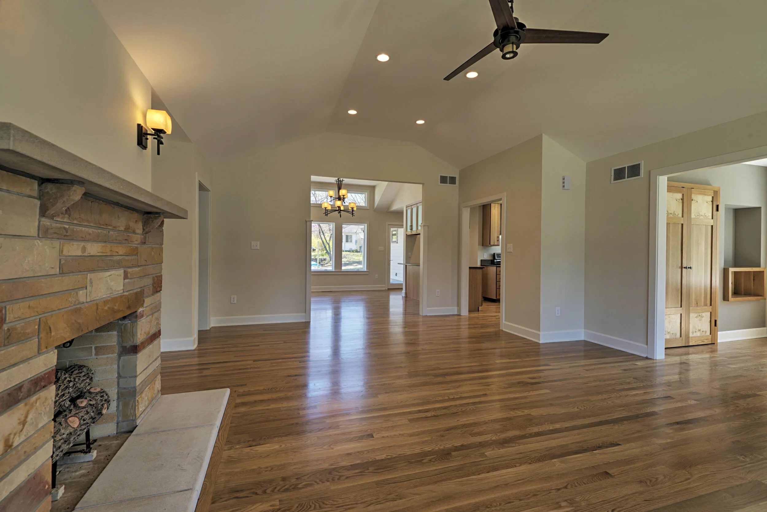 fireplace-wood-floors-backyard-view-home.webp