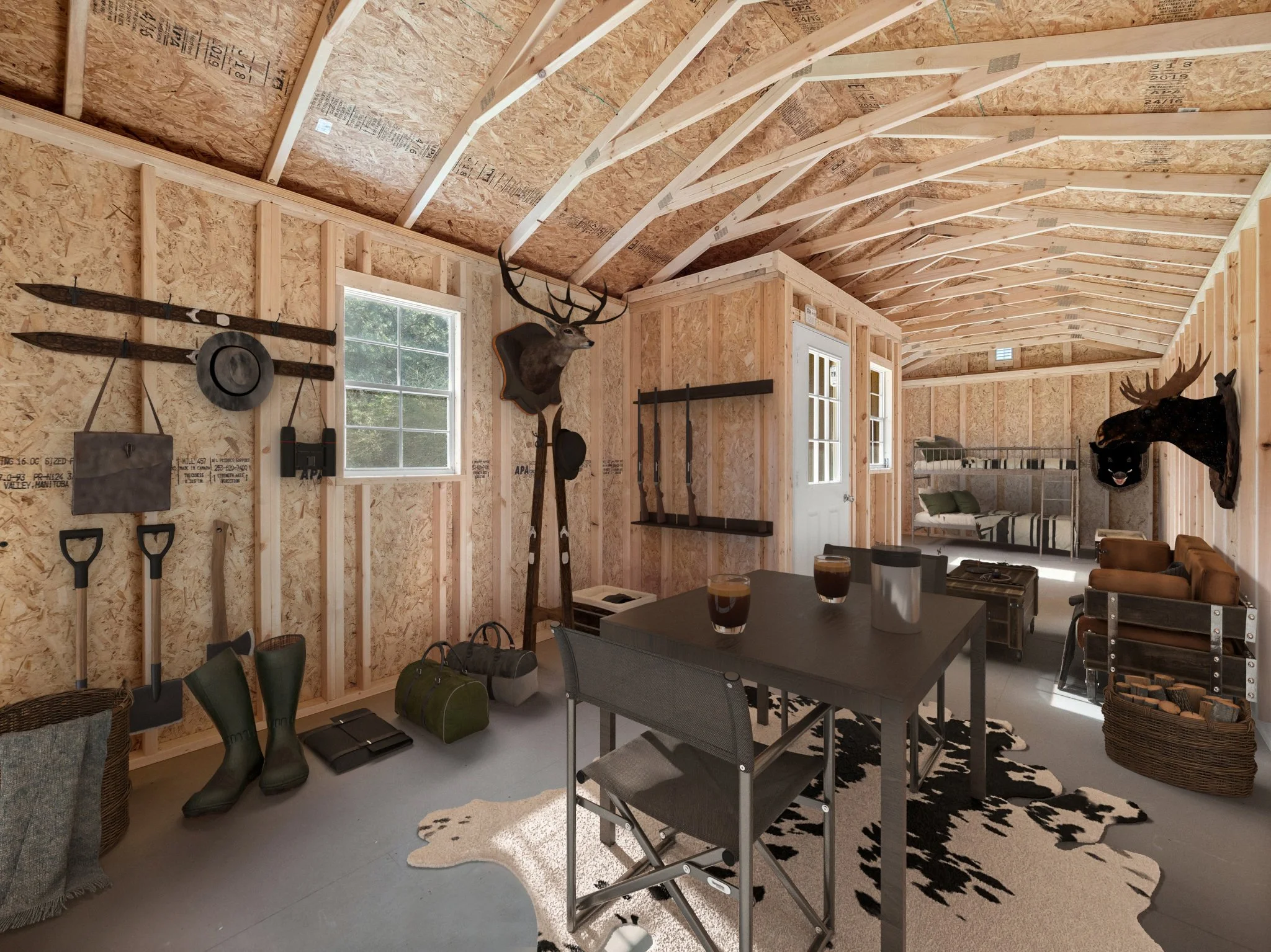 Interior of a partially finished room with exposed wooden framing, windows, and deer mounted on the wall.