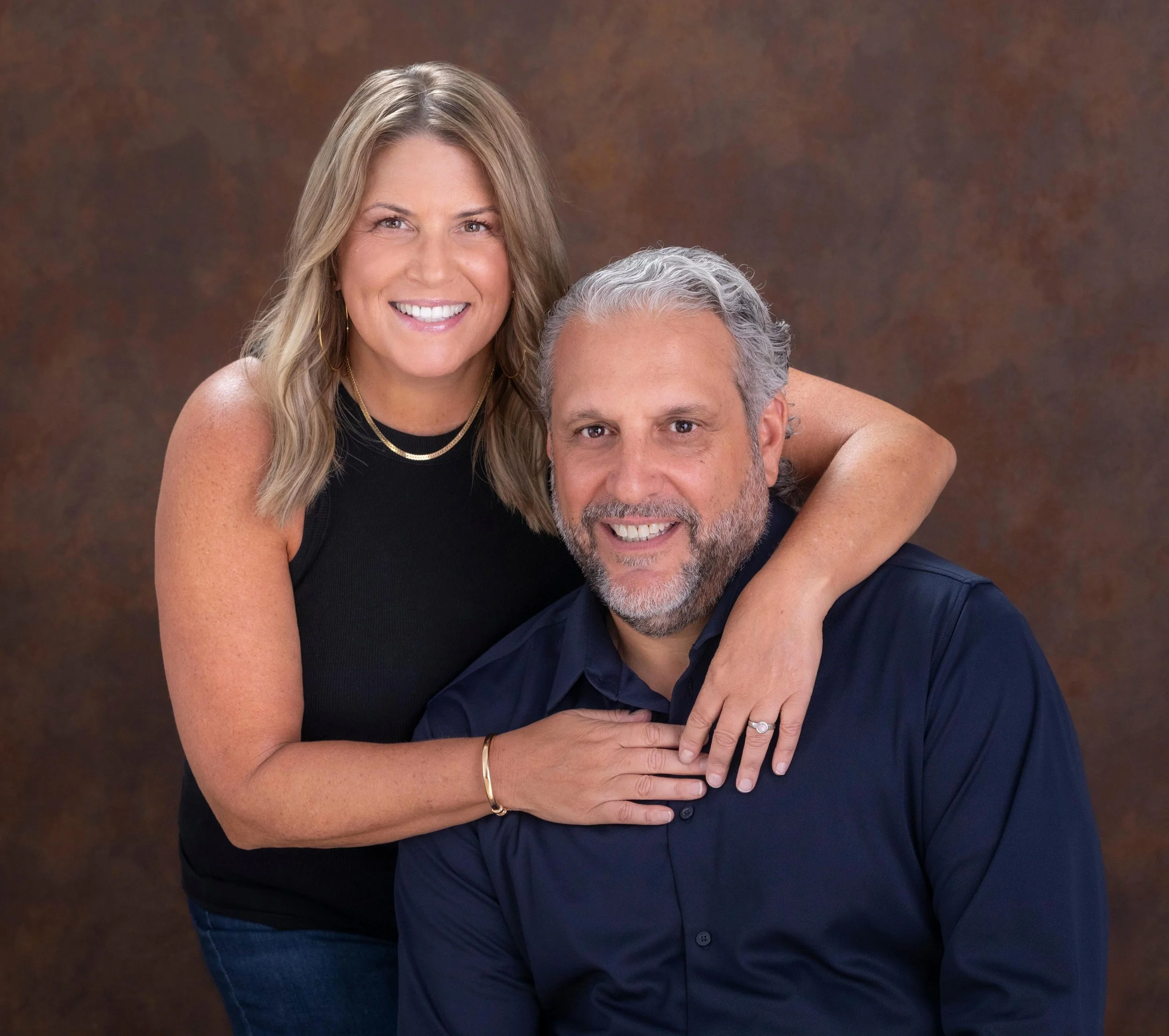 Co-founders Regina and Damian smiling warmly during a consultation for partner/D human-only executive matchmaking firm.