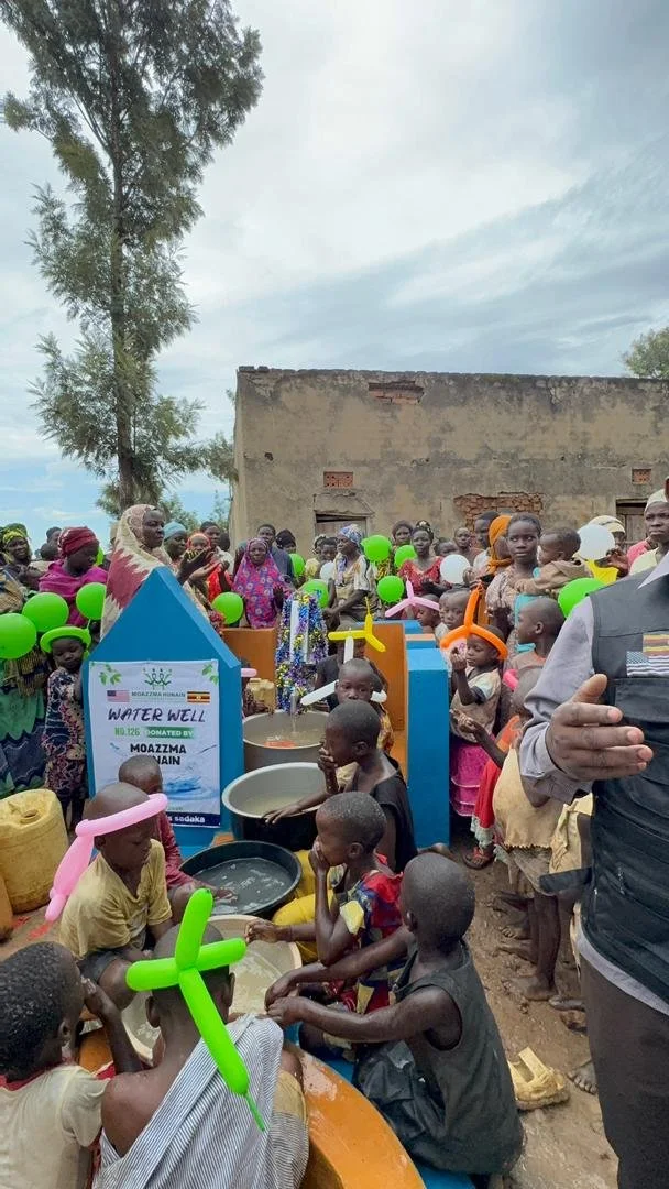 Moazzma Hunain Foundation- impact in Uganda. Children and villagers celebrate the completion of clean water project by Moazzma Hunain Foundation across remote areas in Uganda.