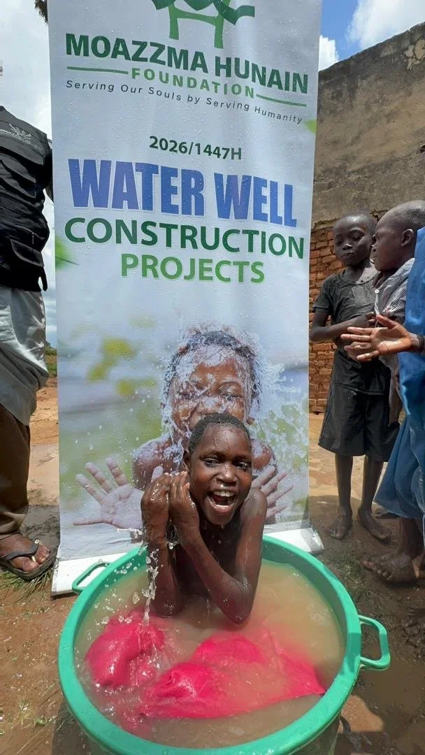 Moazzma Hunain Foundation- impact in Uganda. Children and villagers celebrate clean water project initiative by Moazzma Hunain Foundation across remote areas in Uganda.