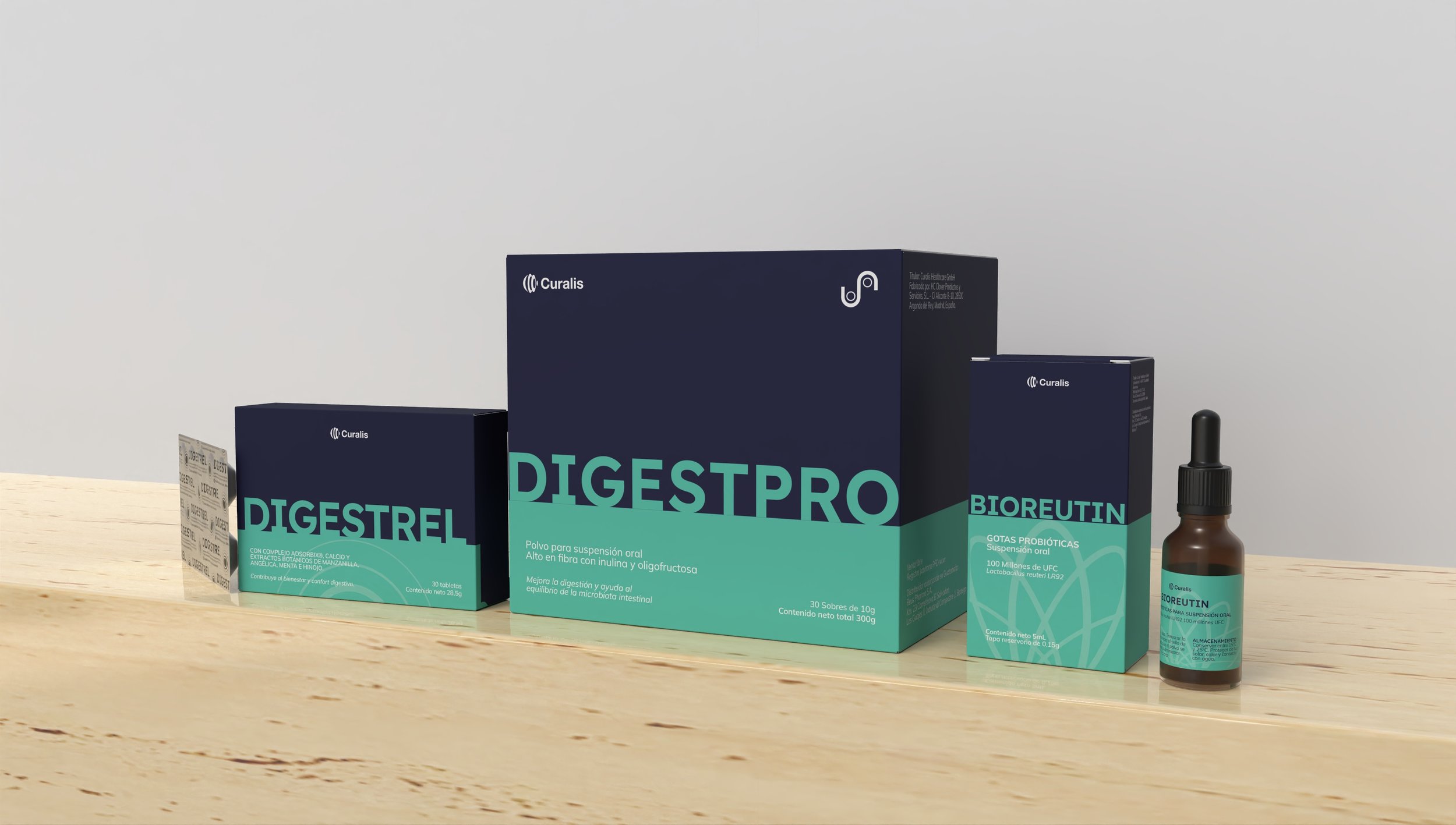 Various dietary supplement products, including boxes labeled 'Digestrol' and 'Bioreutin,' and a small dropper bottle, all placed on a light wooden surface against a plain white wall.