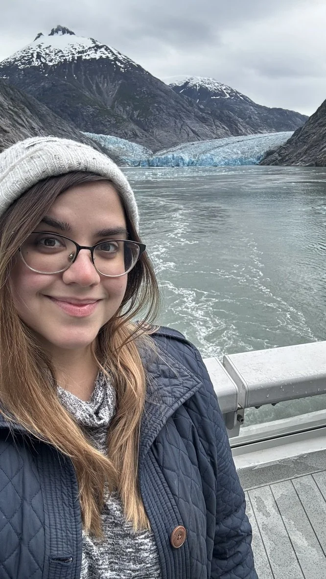 Found of KD Travel Pro on an Alaskan cruise with mountains, water, and the Dawes Glacier in the background.