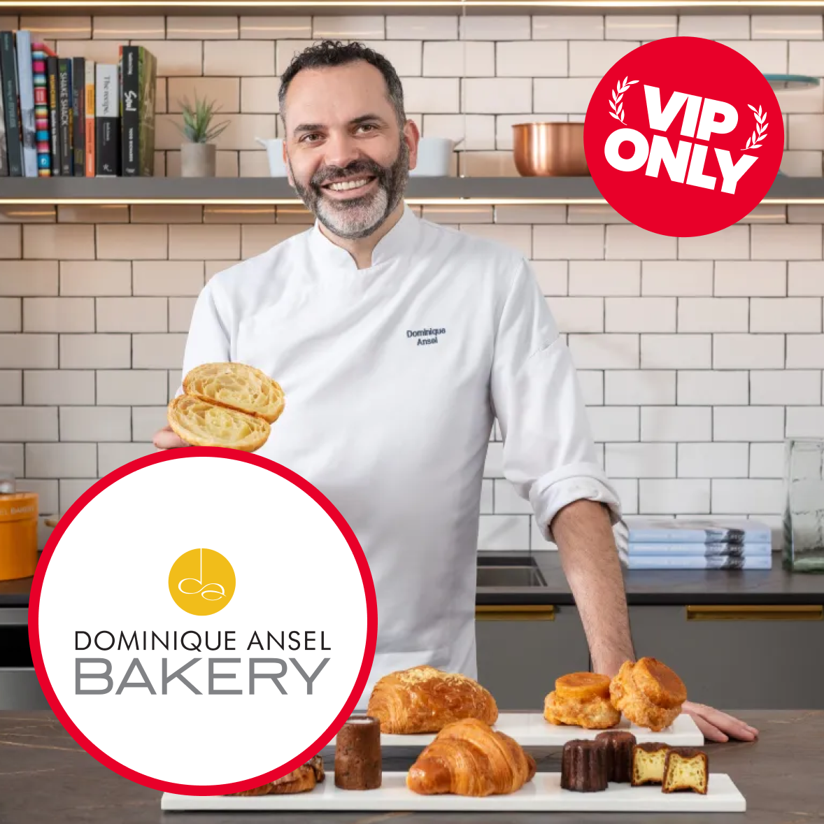Man in bakery uniform standing inside a bakery with a display case of baked goods, signs, and a "VIP ONLY" sticker in the upper right corner.