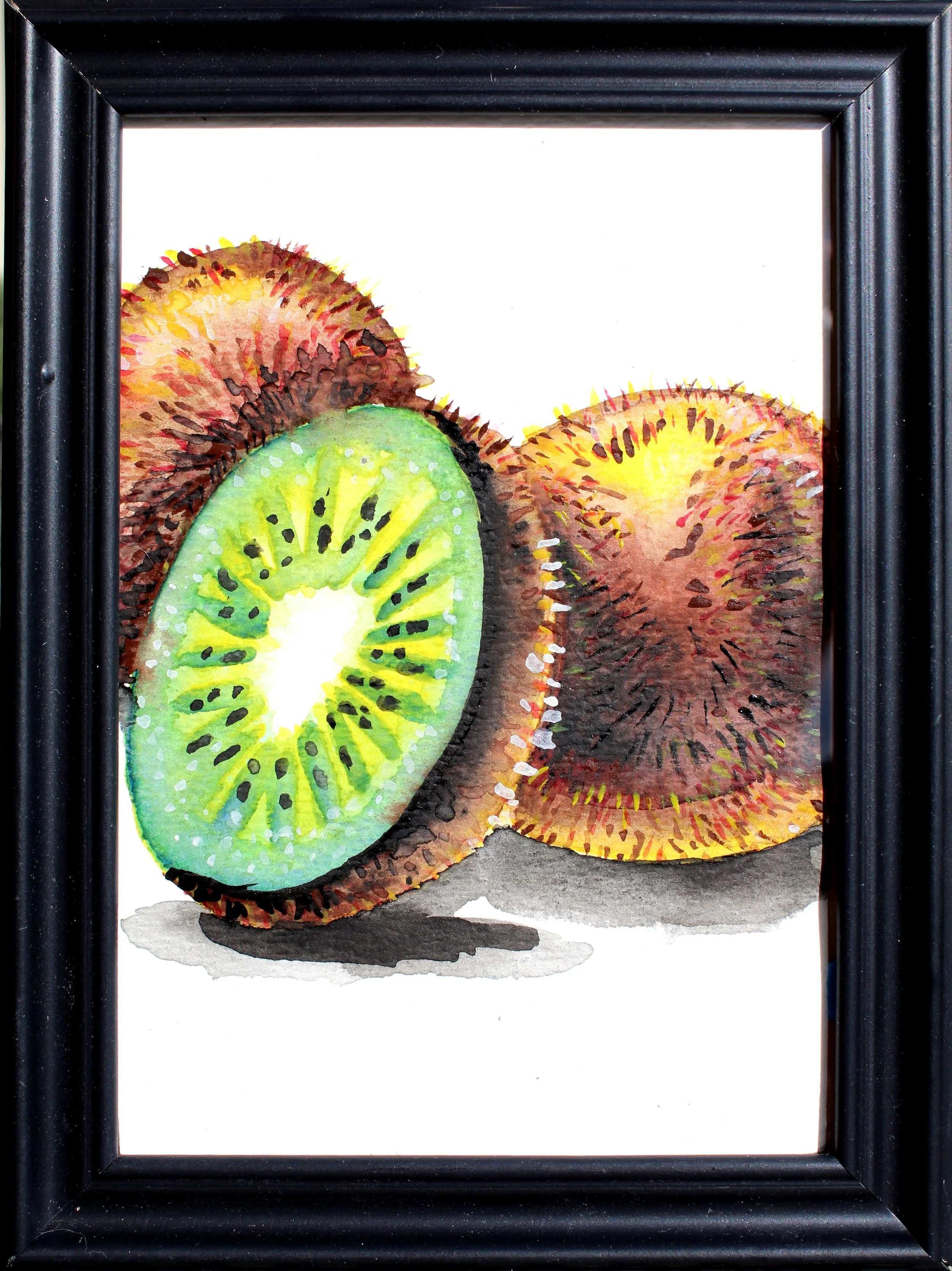 Watercolor painting of two kiwifruits, one sliced open showing green interior with black seeds, the other whole with fuzzy brown exterior, framed in black.