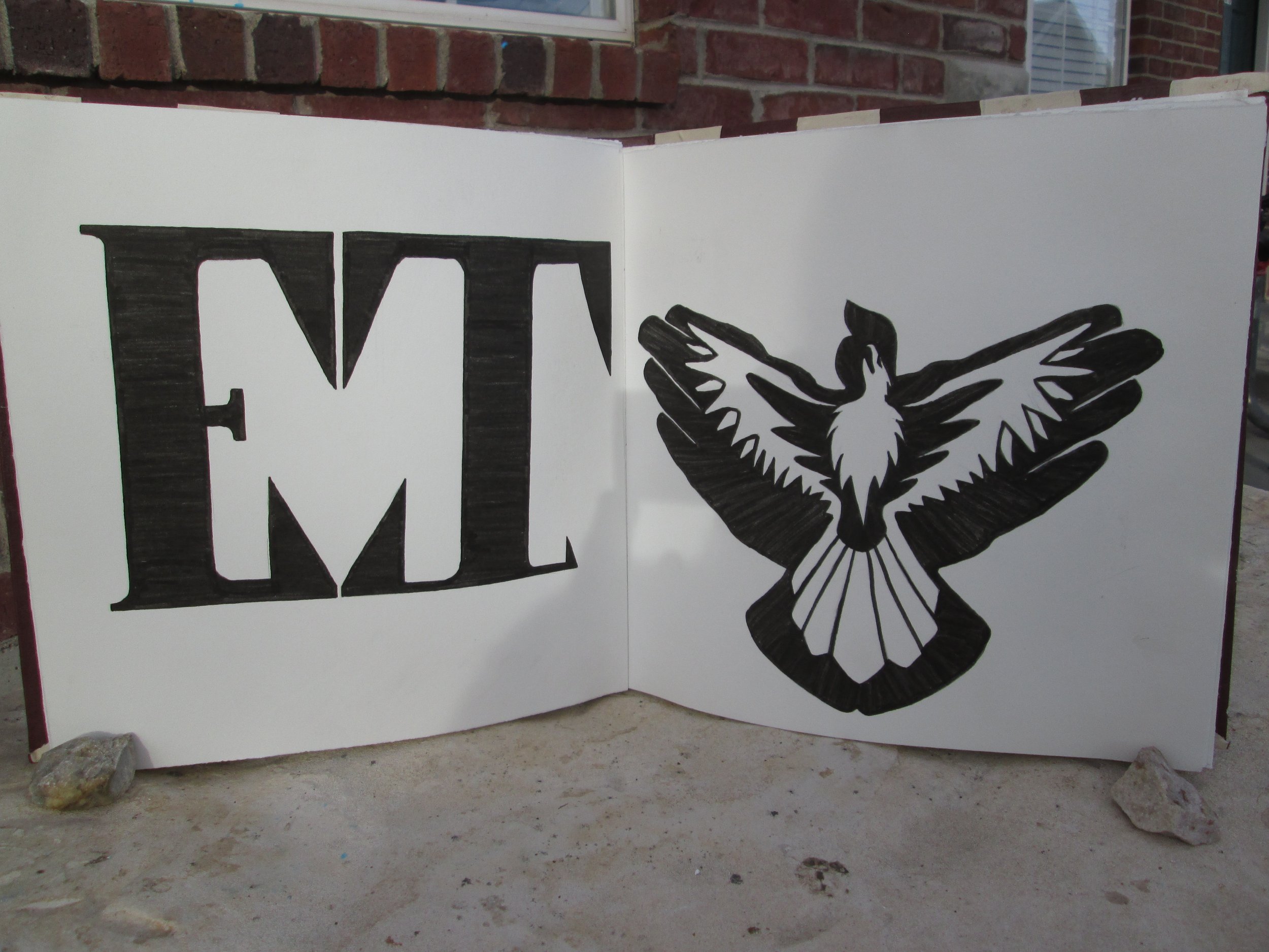 Black and white poster with a large letter 'E', a black and white eagle with outspread wings, and a raised eagle's head.