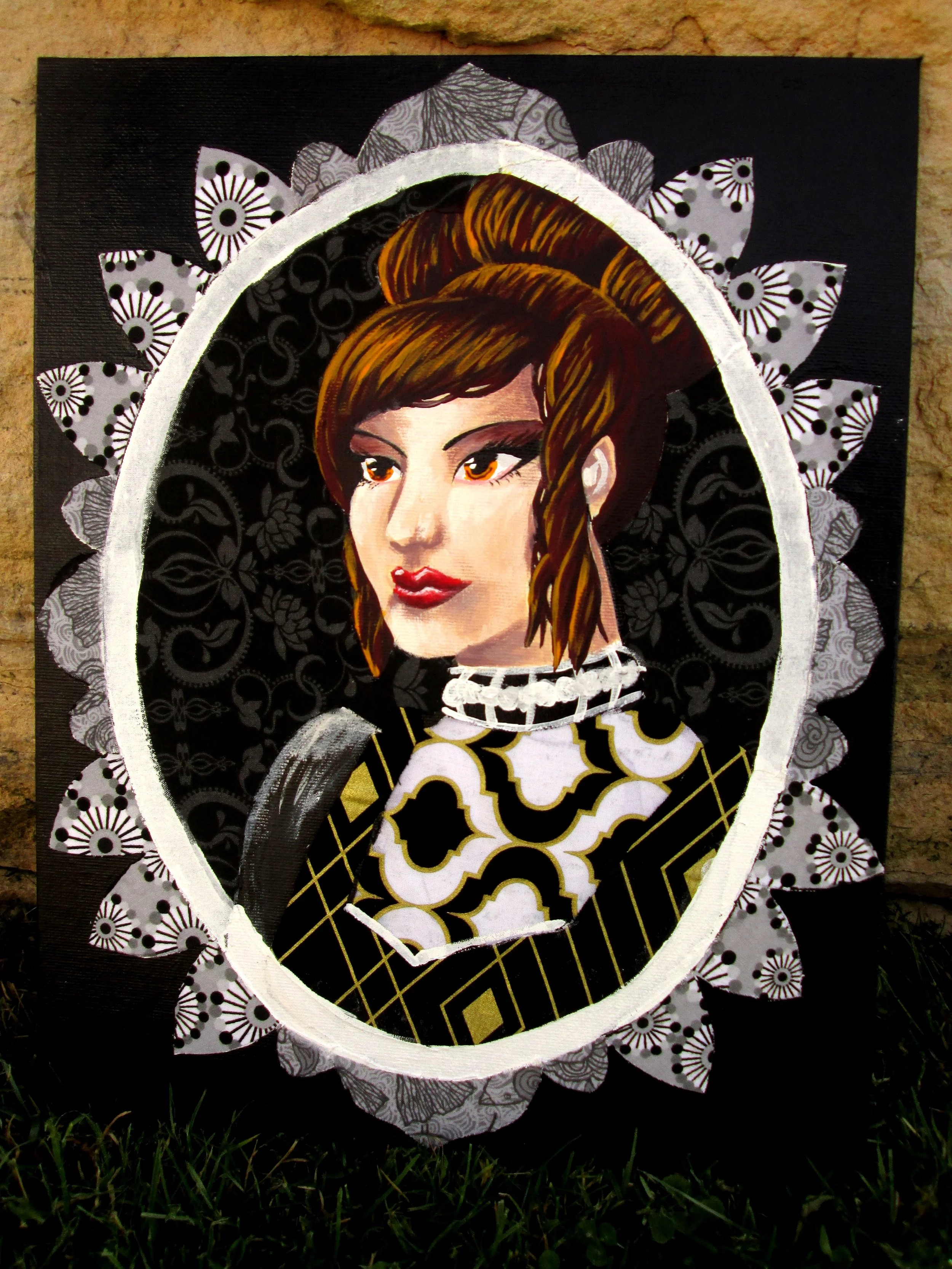 Portrait of a woman with brown hair, painted in a mixed media style with decorative patterns and black background, framed within an oval border, placed outdoors on grass.