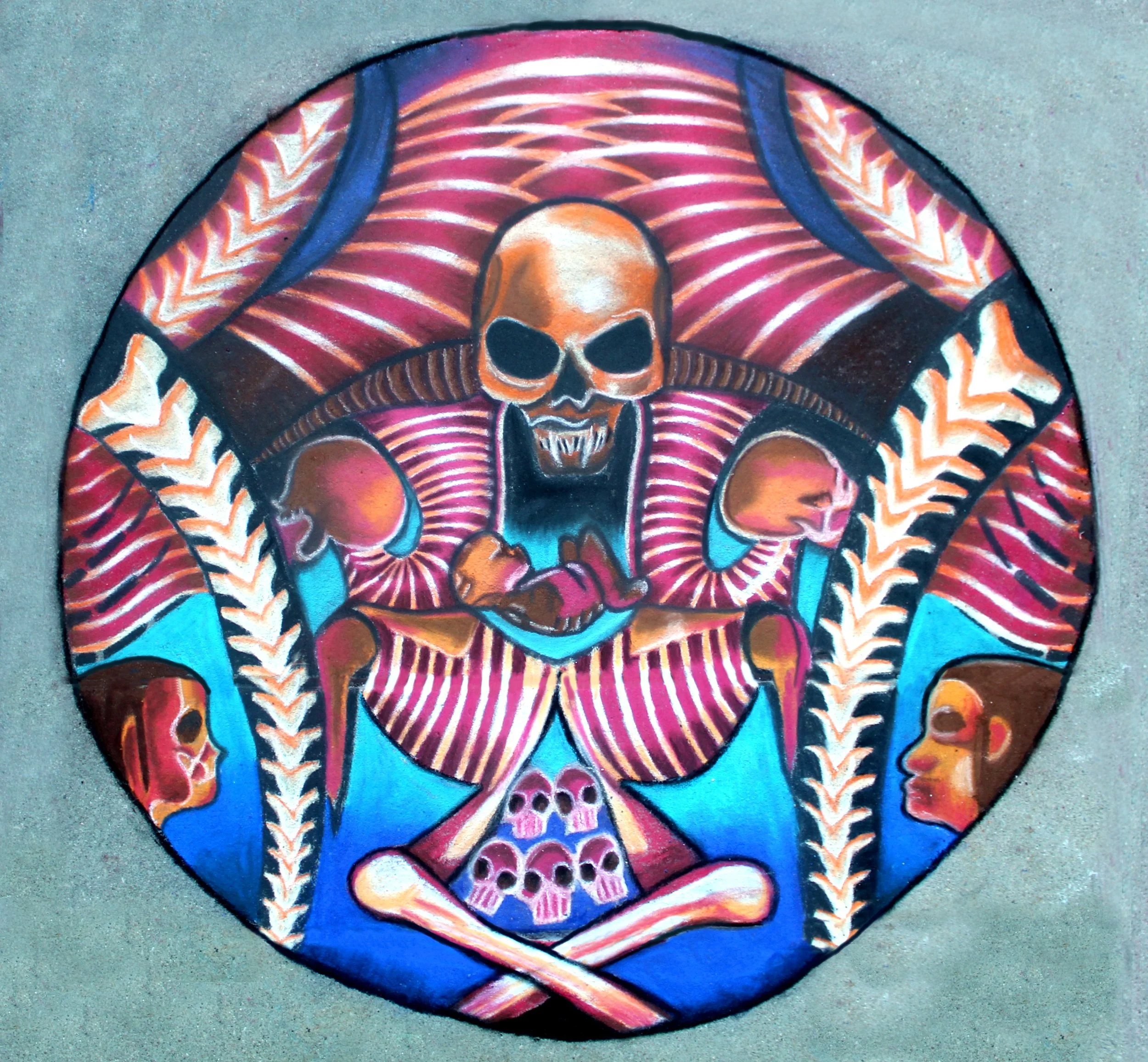 Colorful chalk art of a skull with tribal patterns, vibrant red, pink, black, orange, yellow, blue, and white colors, on gray pavement background.