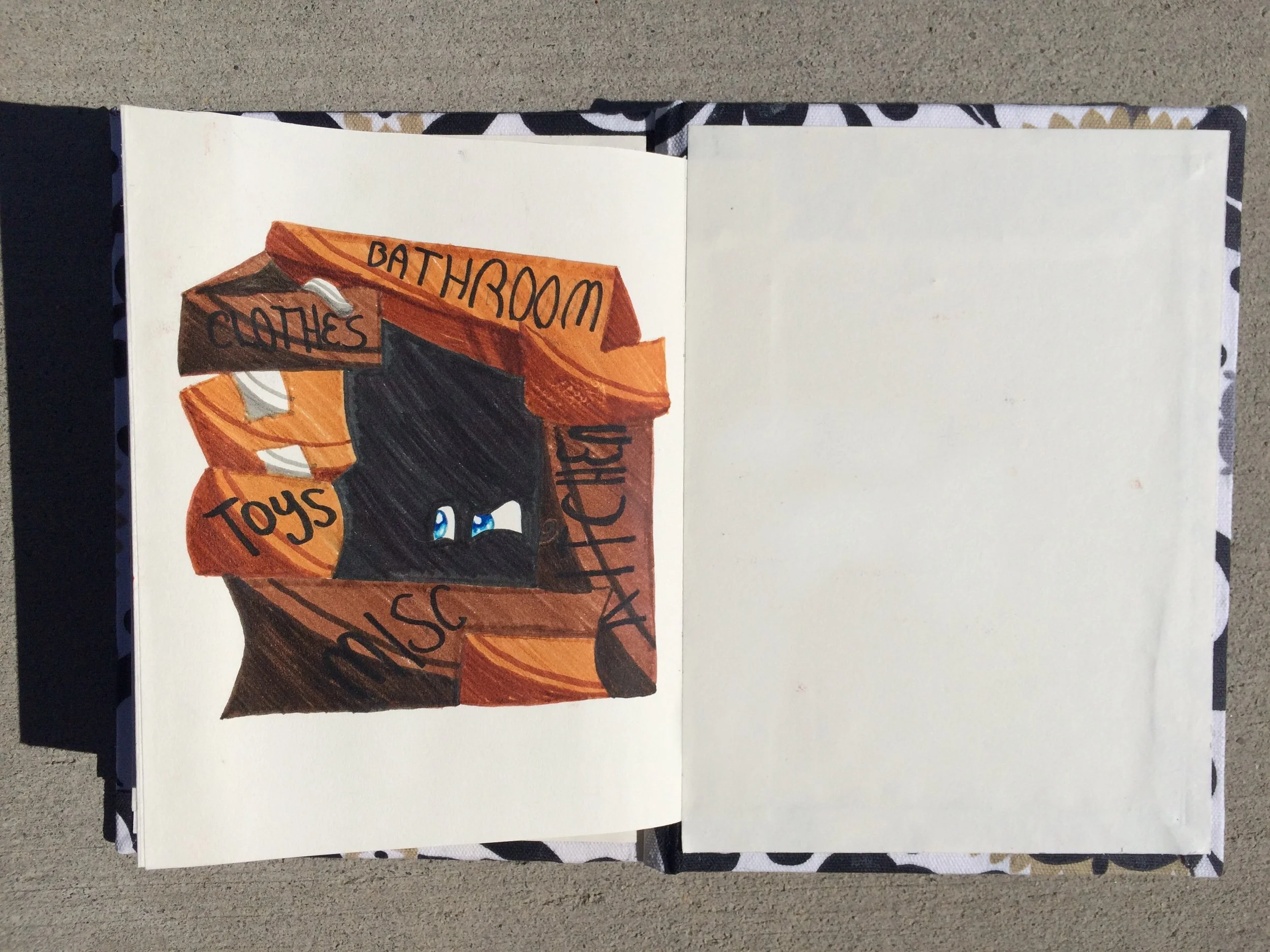 Colorful illustration of a house with a sign that reads 'Bathoom' and 'Clothes' in a sketchbook on a concrete surface.