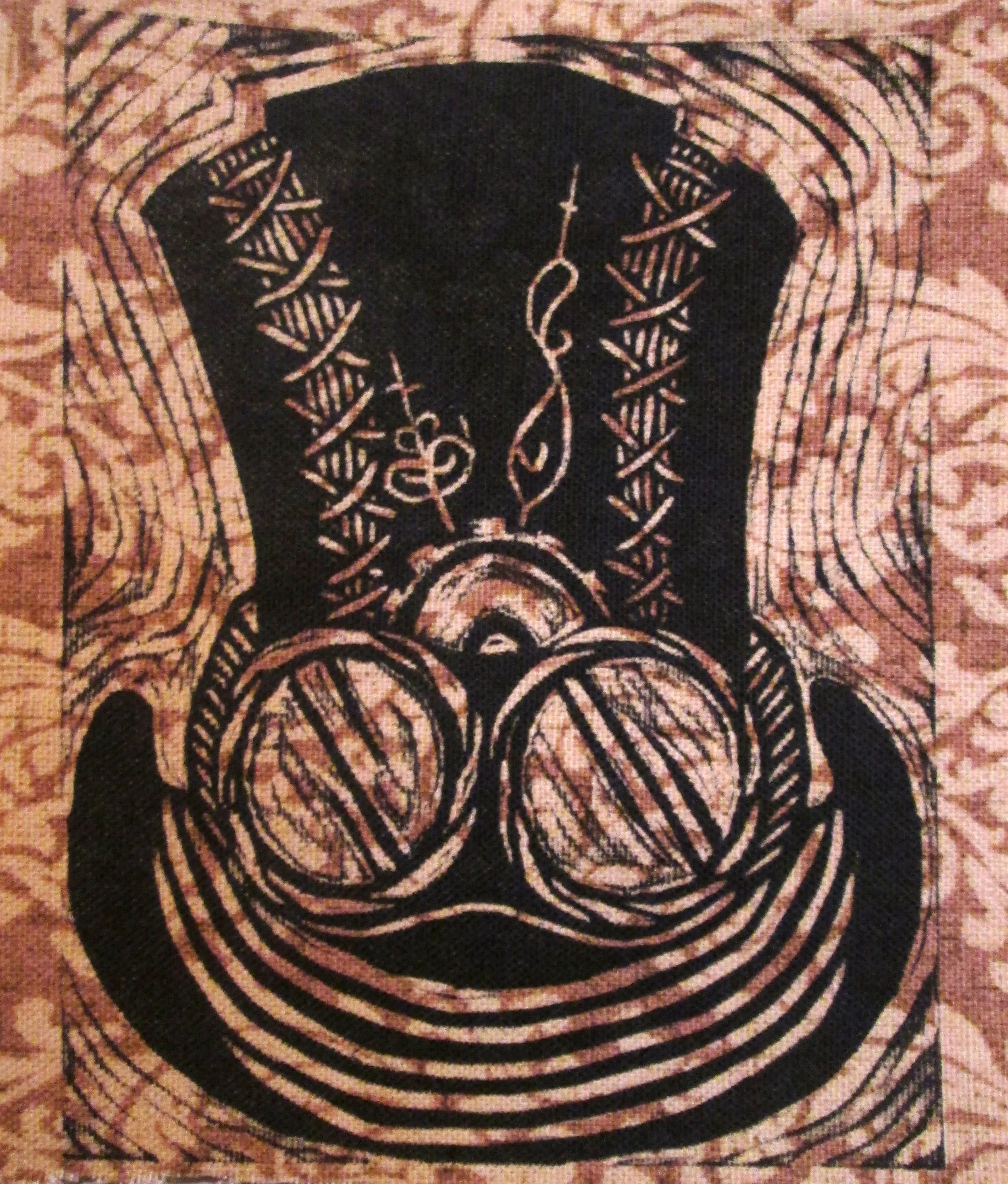 Close-up of an embroidered or woven black fabric with intricate white or light-colored geometric and symmetrical patterns, possibly part of a textile or decorative piece.