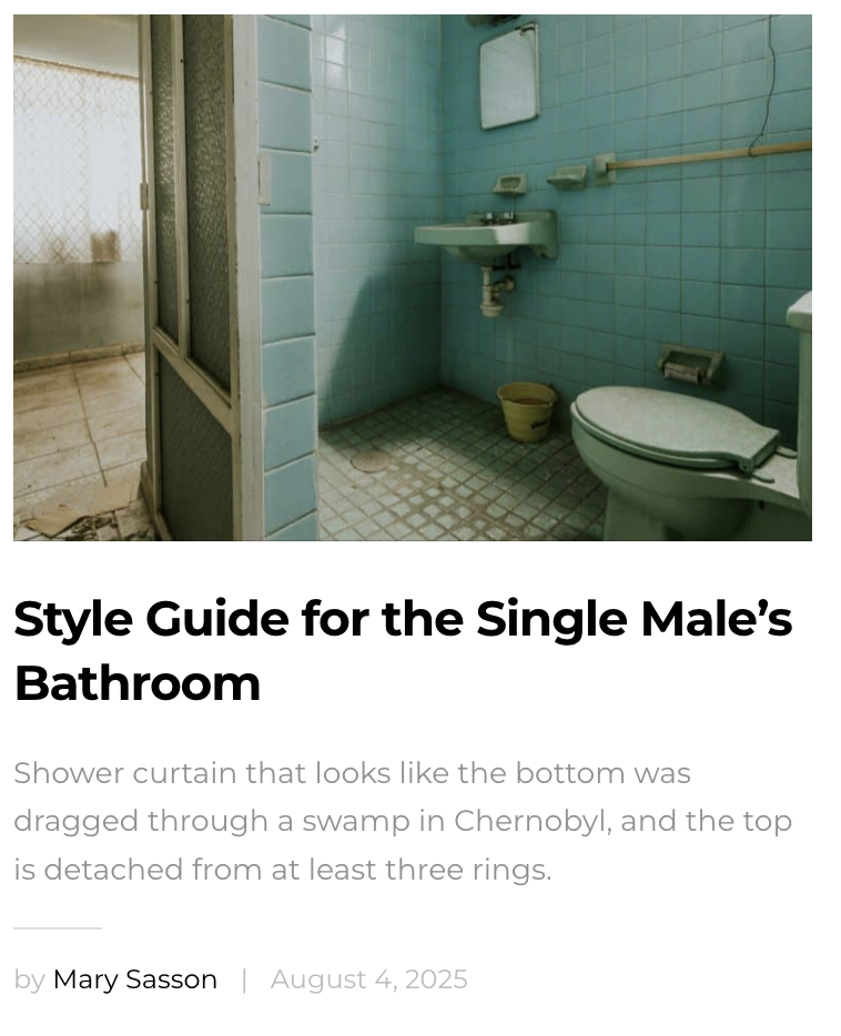 An old, small bathroom with blue tiled walls and floor, featuring a toilet with a bidet attachment, a small sink, and a mirror above the sink. There is a yellow bucket on the floor and a narrow shower area separated by a frosted glass door.