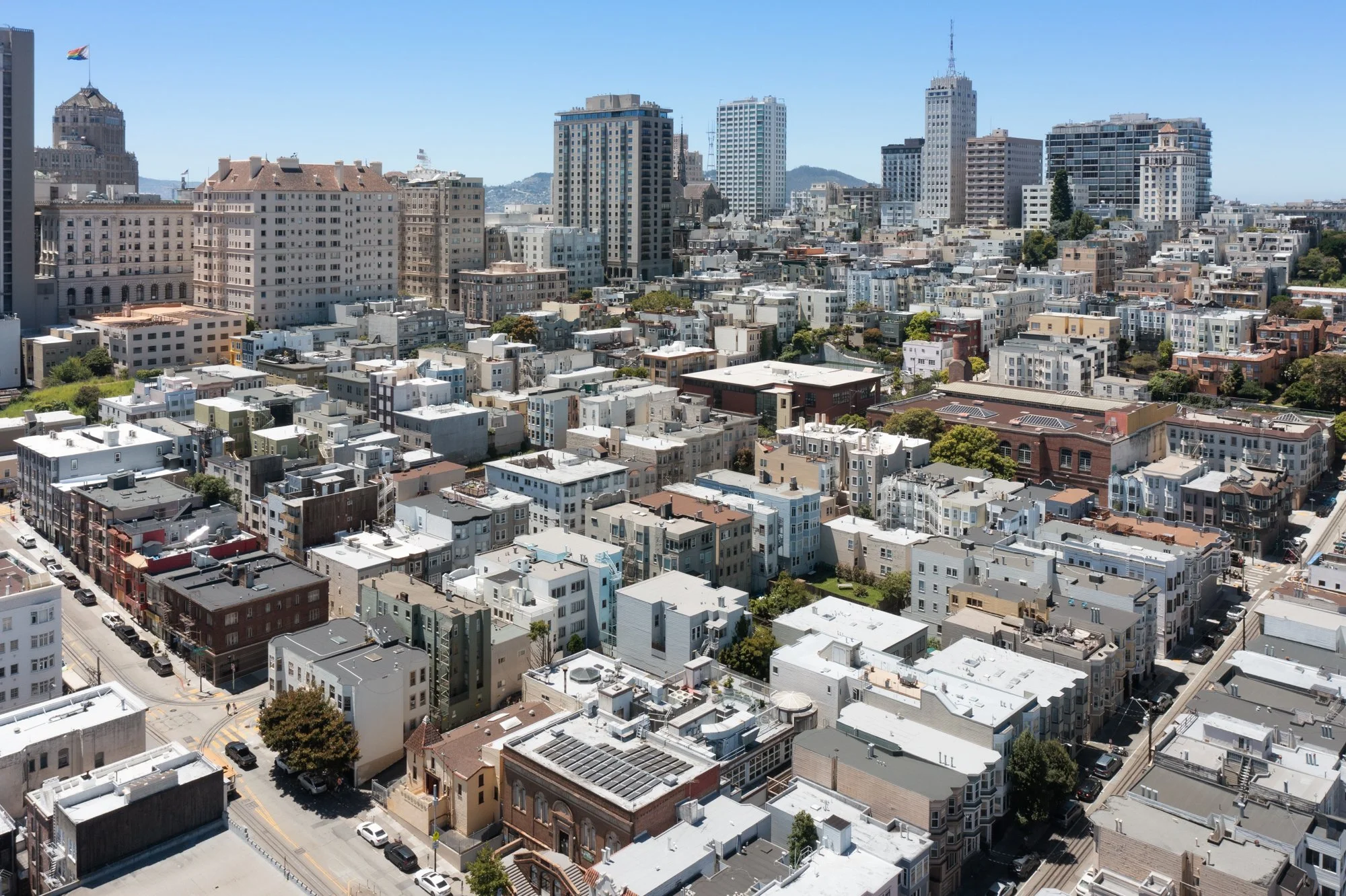 Cityscape view of buildings in San Francisco with a clear blue sky.