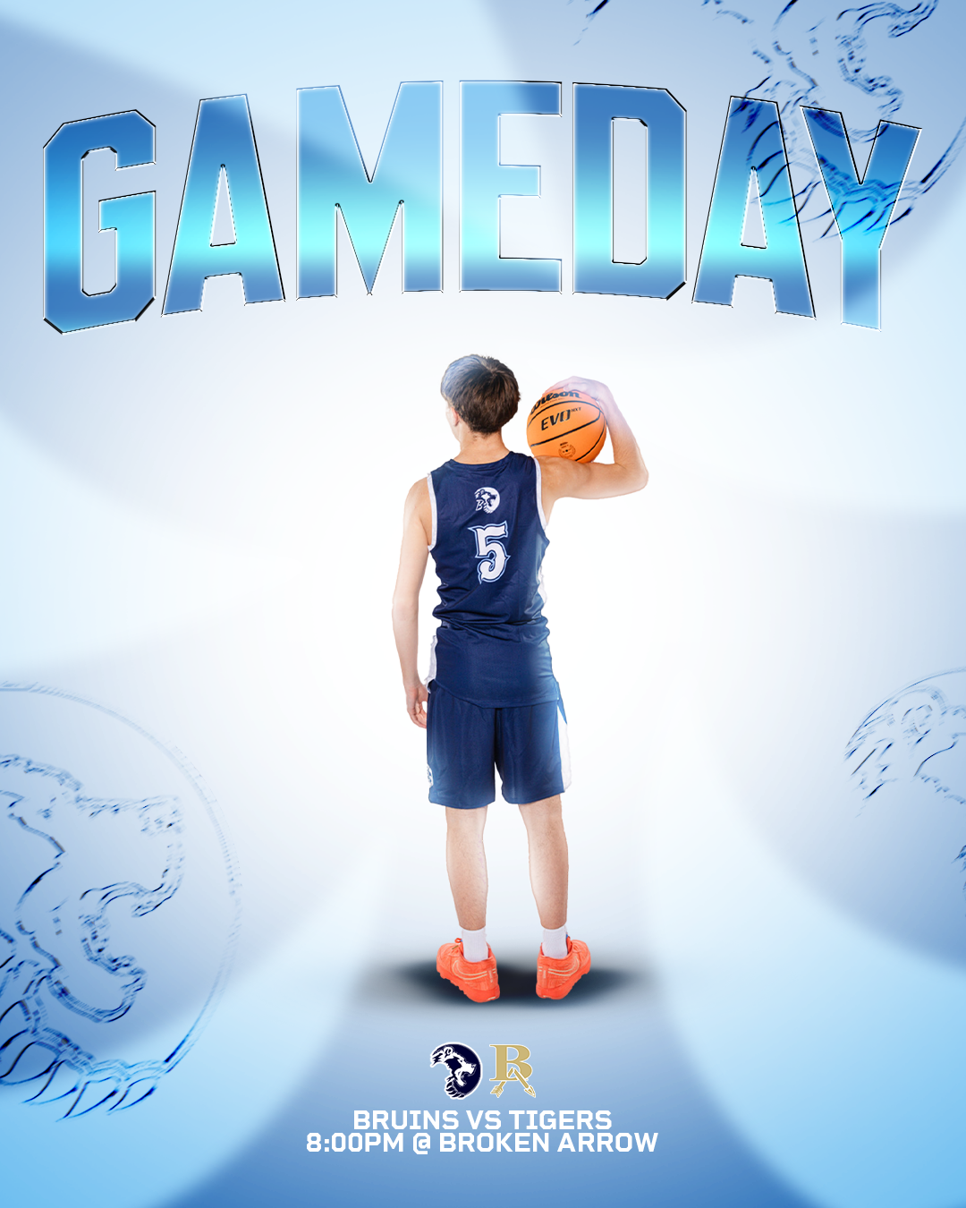 A young basketball player in a blue uniform holding an orange basketball, facing away, with the text 'GAMEDAY' above and details of an upcoming college basketball game below: ''Bruins vs Tigers 8:00 PM @ Broken Arrow''.