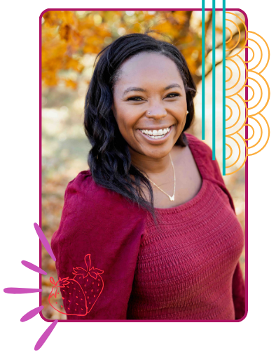 A Black woman with dark hair smiling outdoors, wearing a maroon sweater and a gold necklace, with colorful graphic borders and autumn leaves in the background.