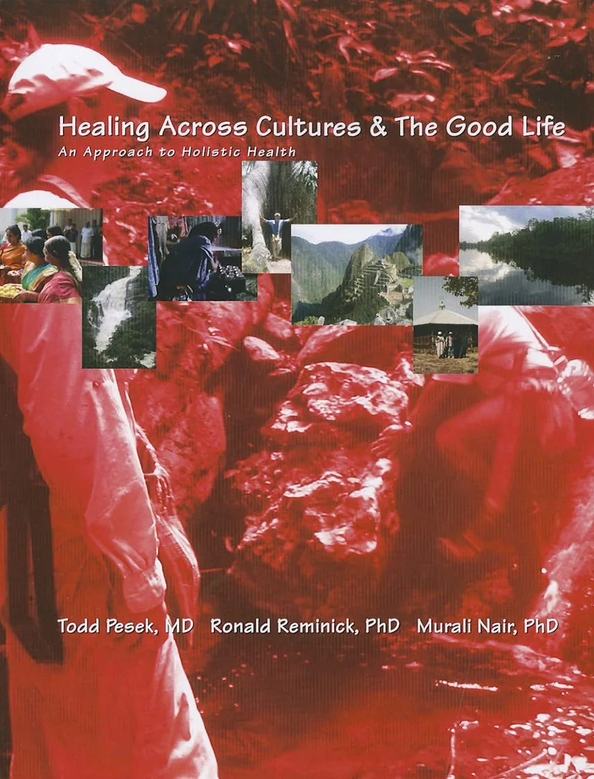 Cover of a book titled "Healing Across Cultures & The Good Life: An Approach to Holistic Health" with images of diverse cultural activities and landscapes, set against a red background with a white cap and silhouette of a person in a field.