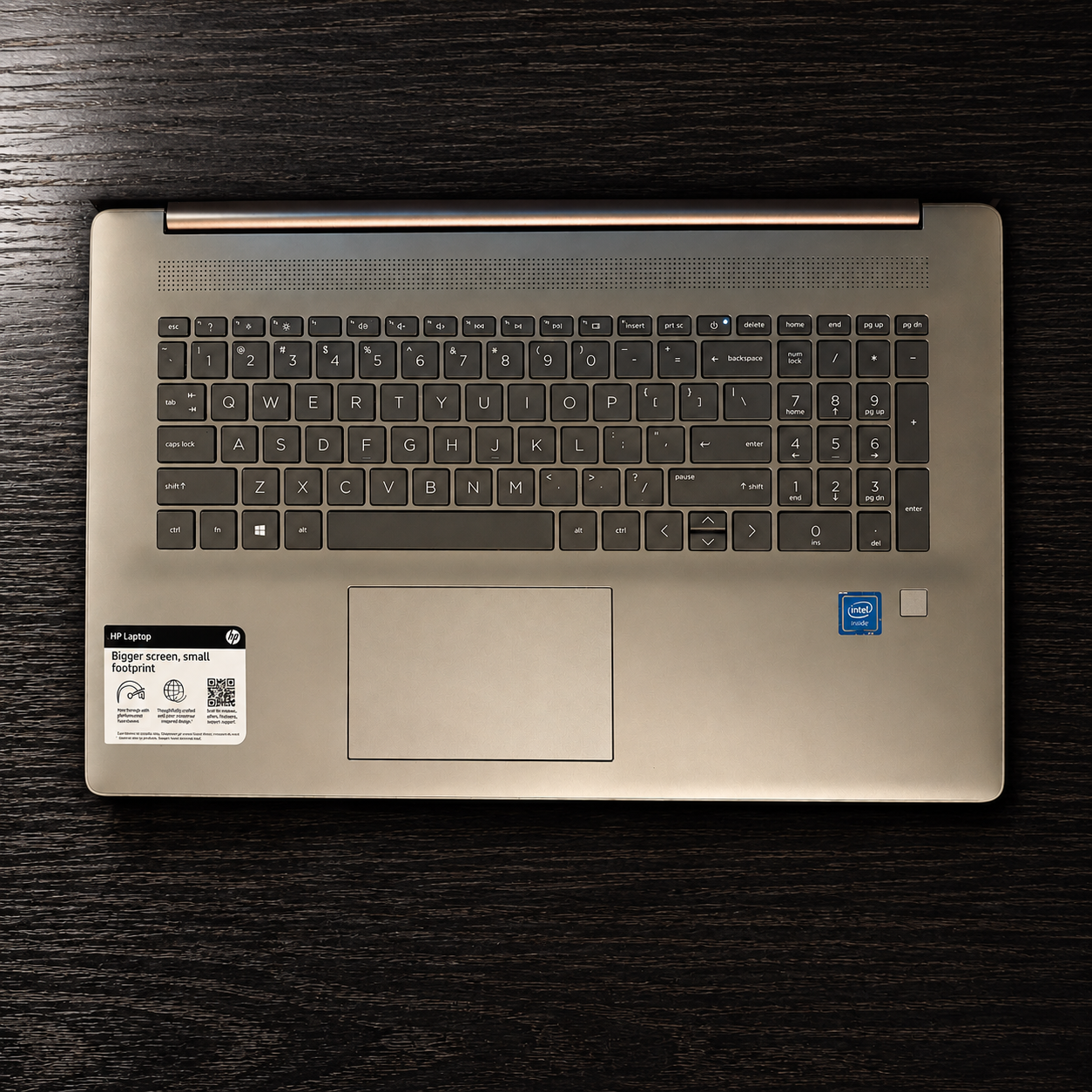 Laptop on a dark wood tabletop.png