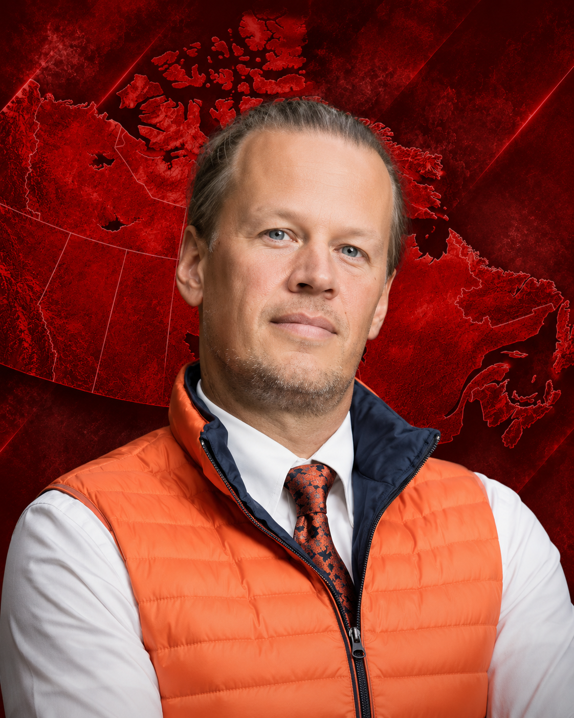 A man with blonde hair and blue eyes wearing a white shirt, a patterned red tie, and an orange puffer vest, standing in front of a digital red map of Canada.