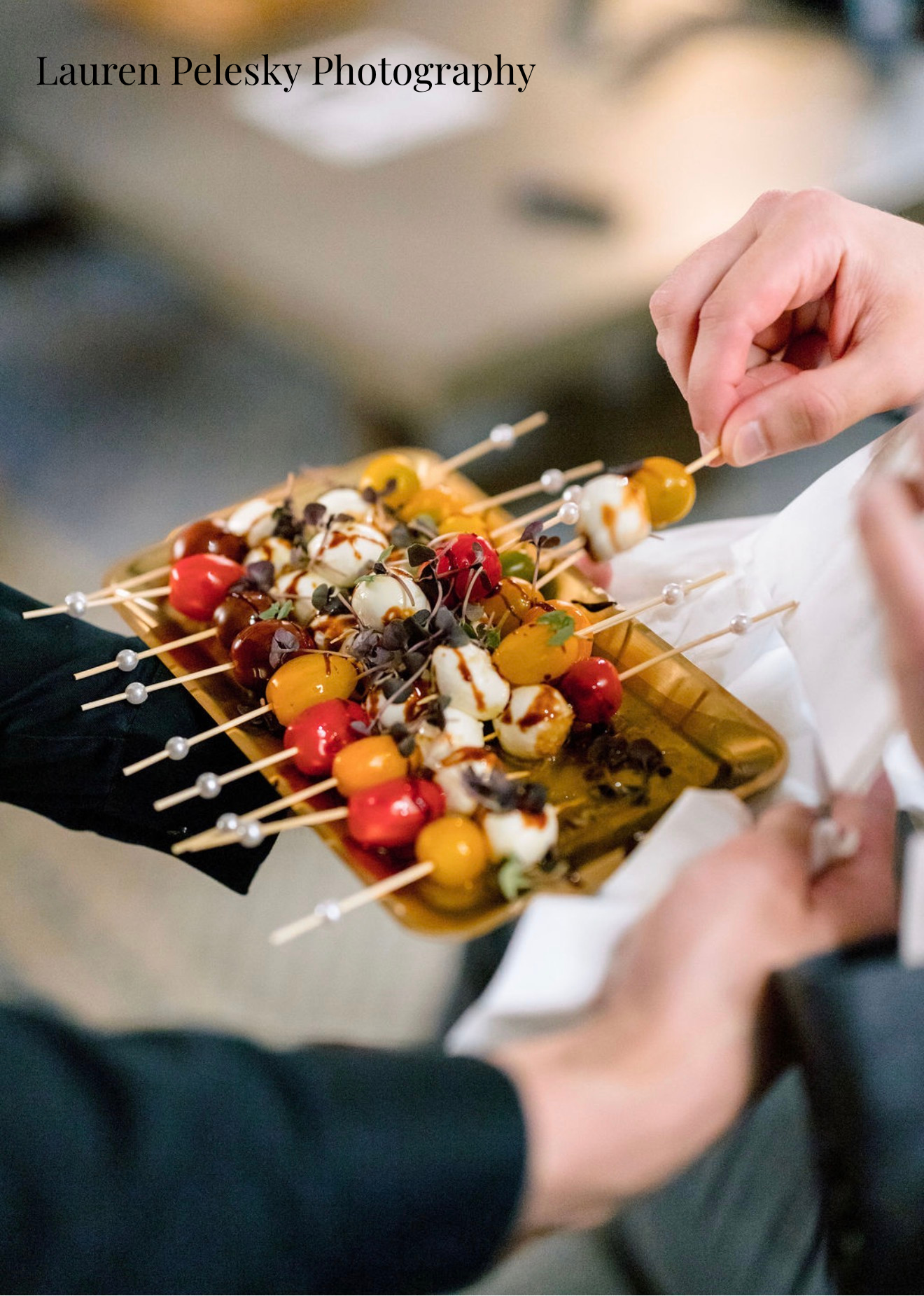 A cocktail hour appetizer of skewers with tomato and mozzarella is passed around at a cocktail hour in Franklin, Tennessee.