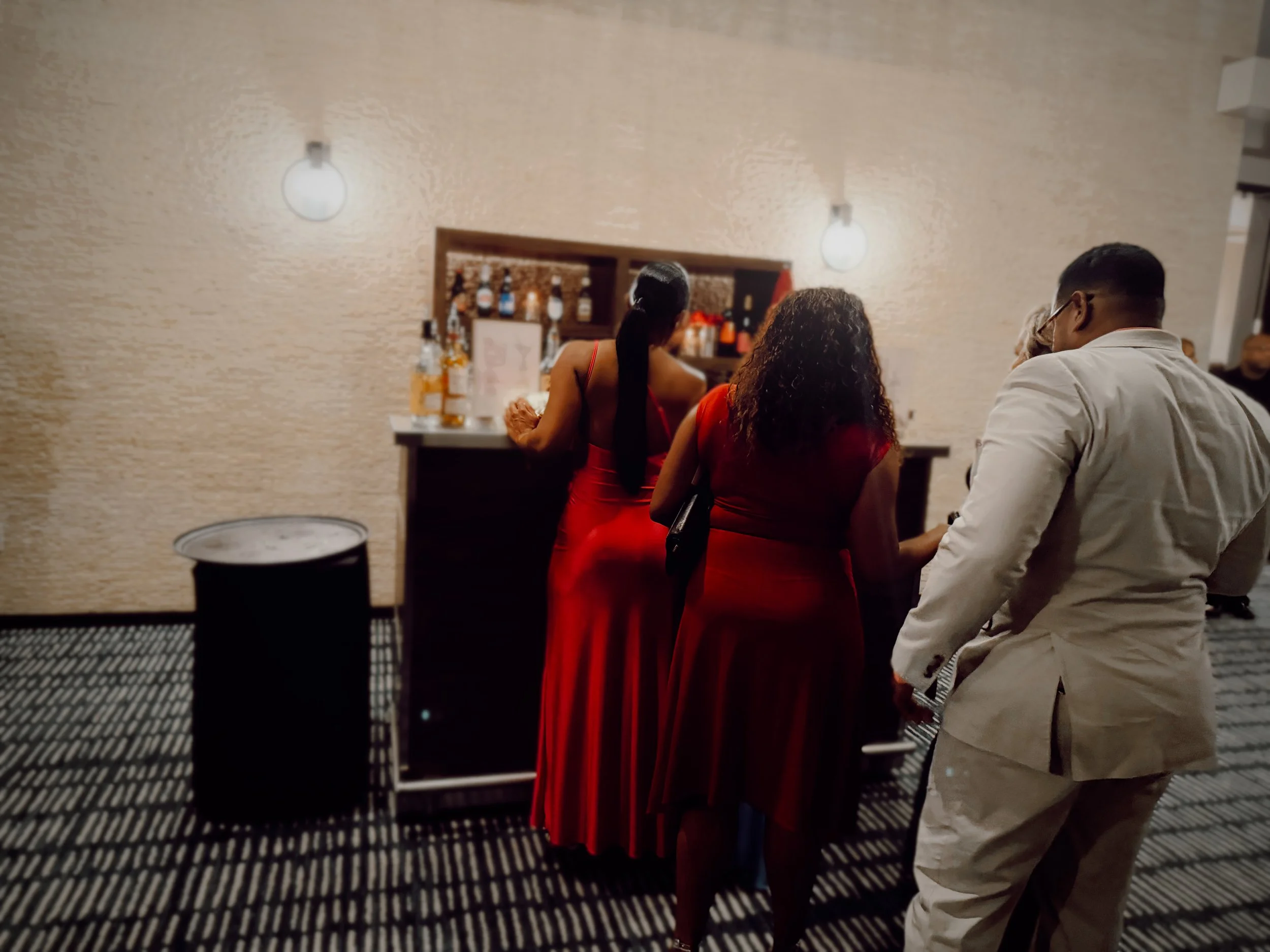 Guests wait in line for a drink at a bar at a hotel wedding reception in Nashville, Tennessee.