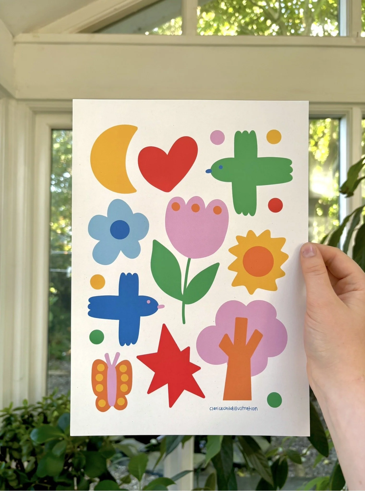Colorful illustration featuring various shapes such as a crescent moon, heart, cross, flower, star, and tree, with small dots around them, on a white background. The assistant's signature, 'claricechildillustration,' is visible at the bottom.