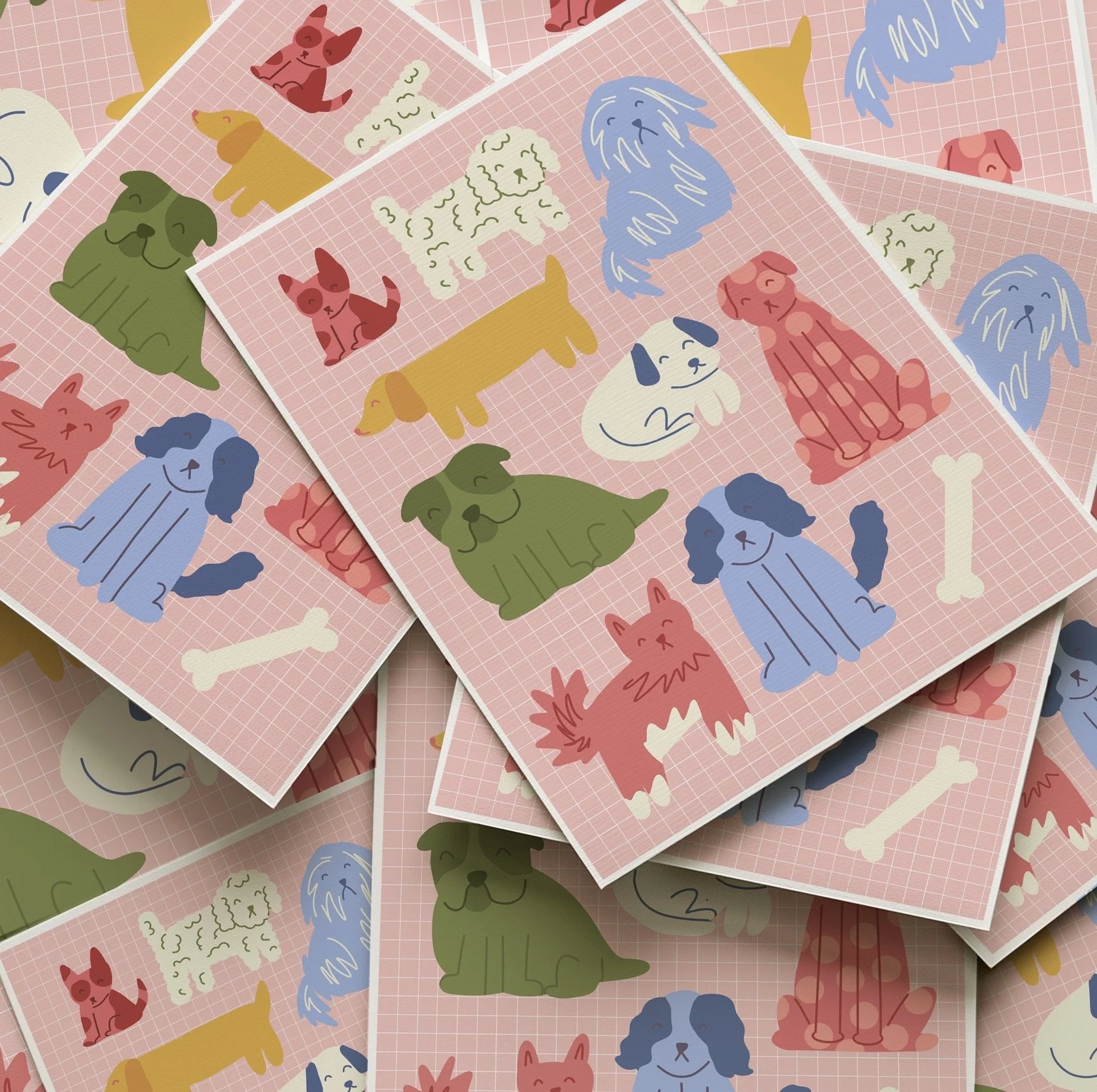 Multiple sheets with cartoon illustrations of various dog breeds in different colors on a pink grid background.