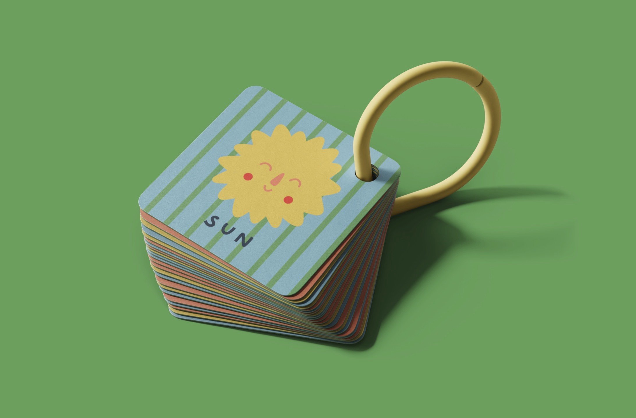 Stack of colorful cards with a smiling sun illustration and the word 'sun' on a green background.
