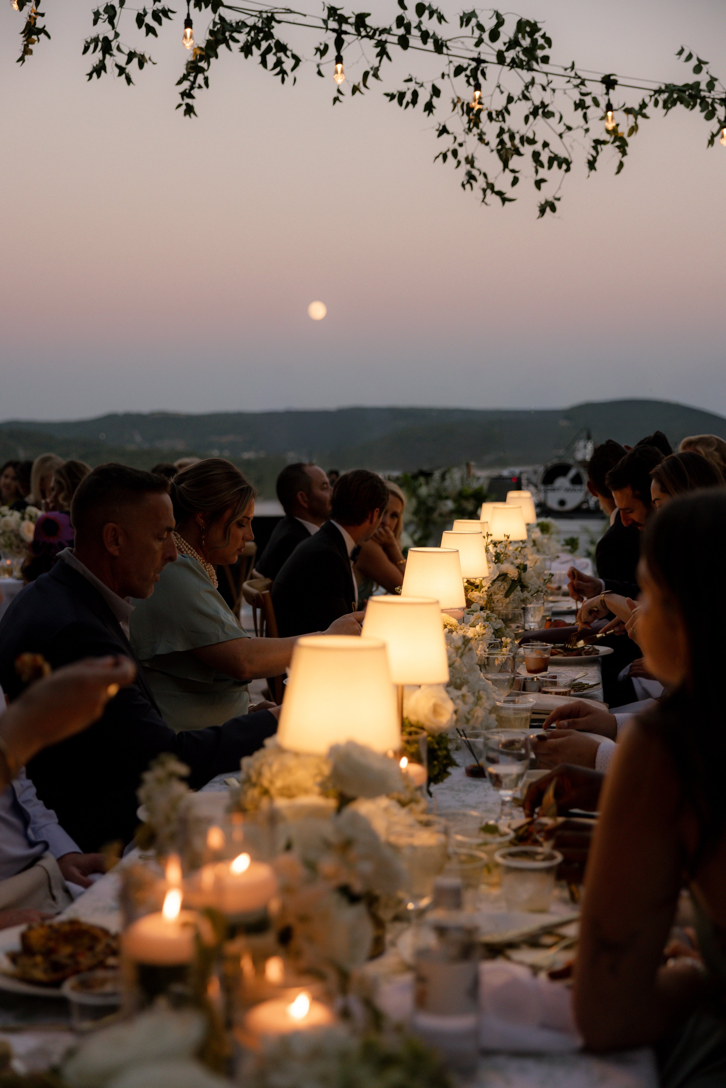Candlelight lakefront wedding reception photography