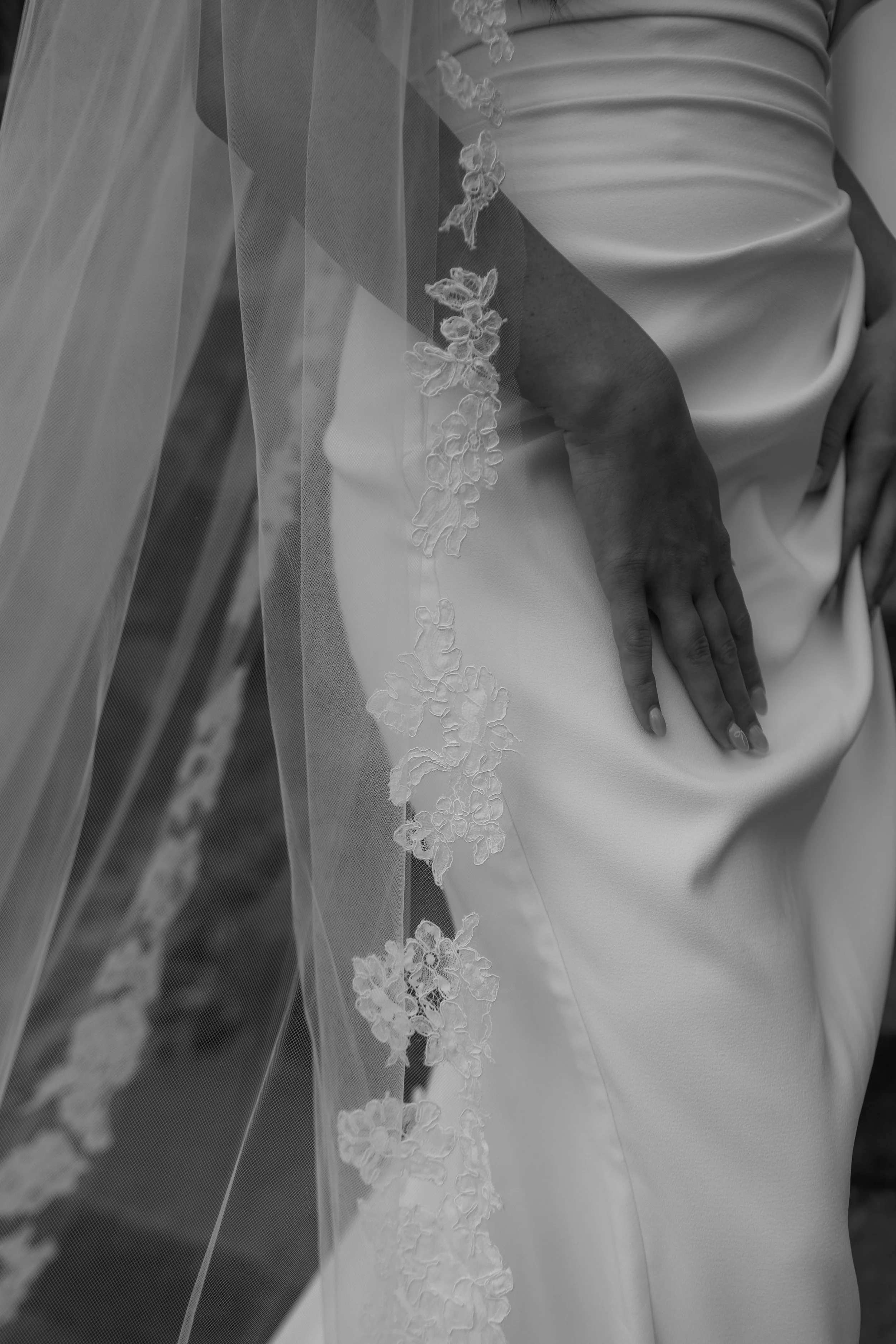 dramatic black and white image of satin bridal dress