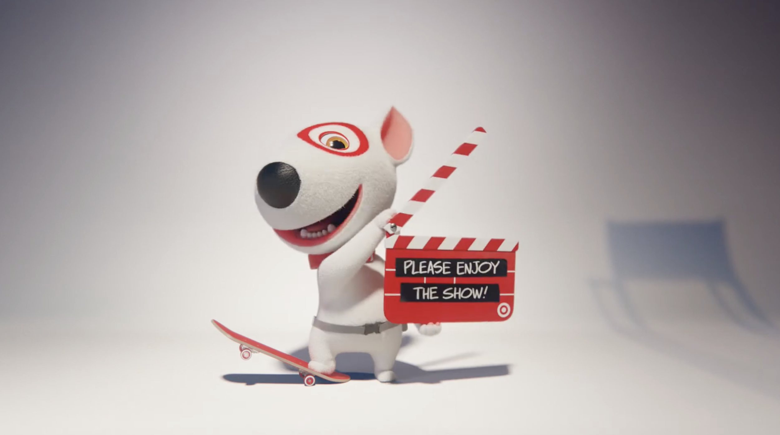A cartoon dog mascot holding a clapperboard with the text 'Please Enjoy the Show!', standing on a skateboard with a skateboard ramp nearby, against a plain background.