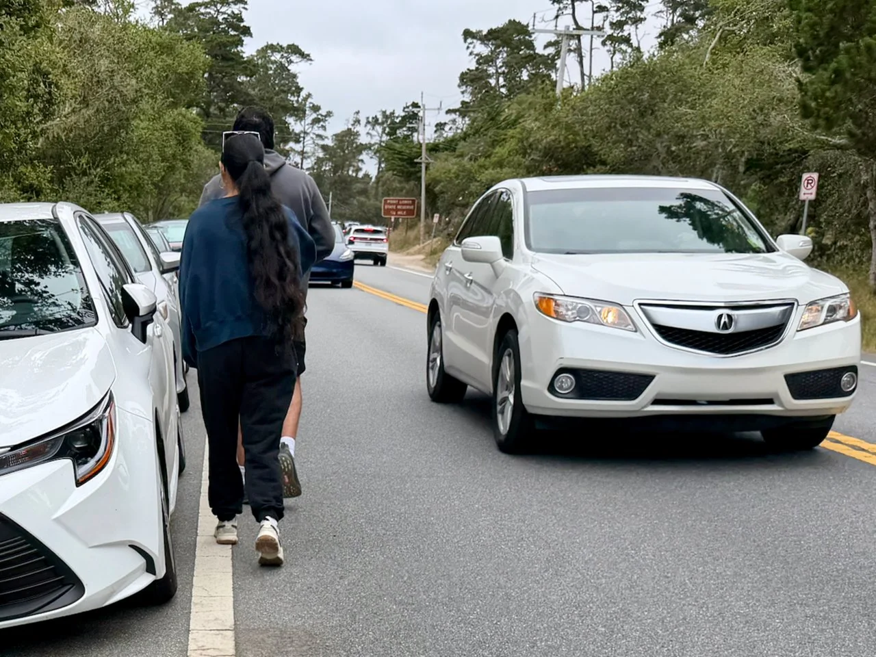 There is no off-highway access for pedestrians walking from their car to Point Lobos.  Visitors are forced to walk ON the road in the path of oncoming traffic.