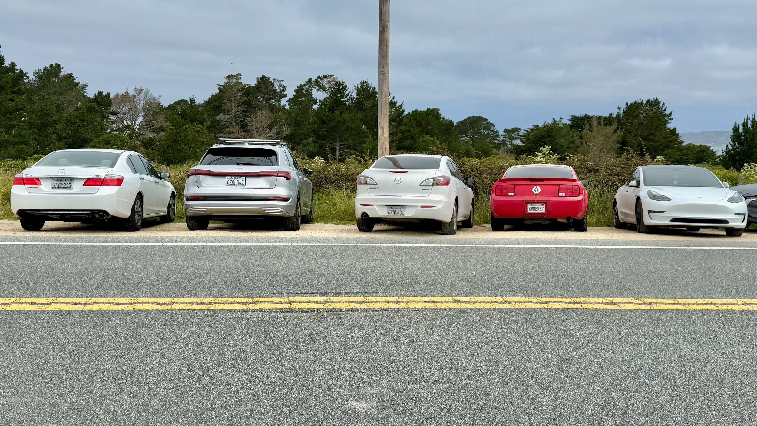 Are these cars parked 'parallel'? This row of vehicles are parked parallel to each other!